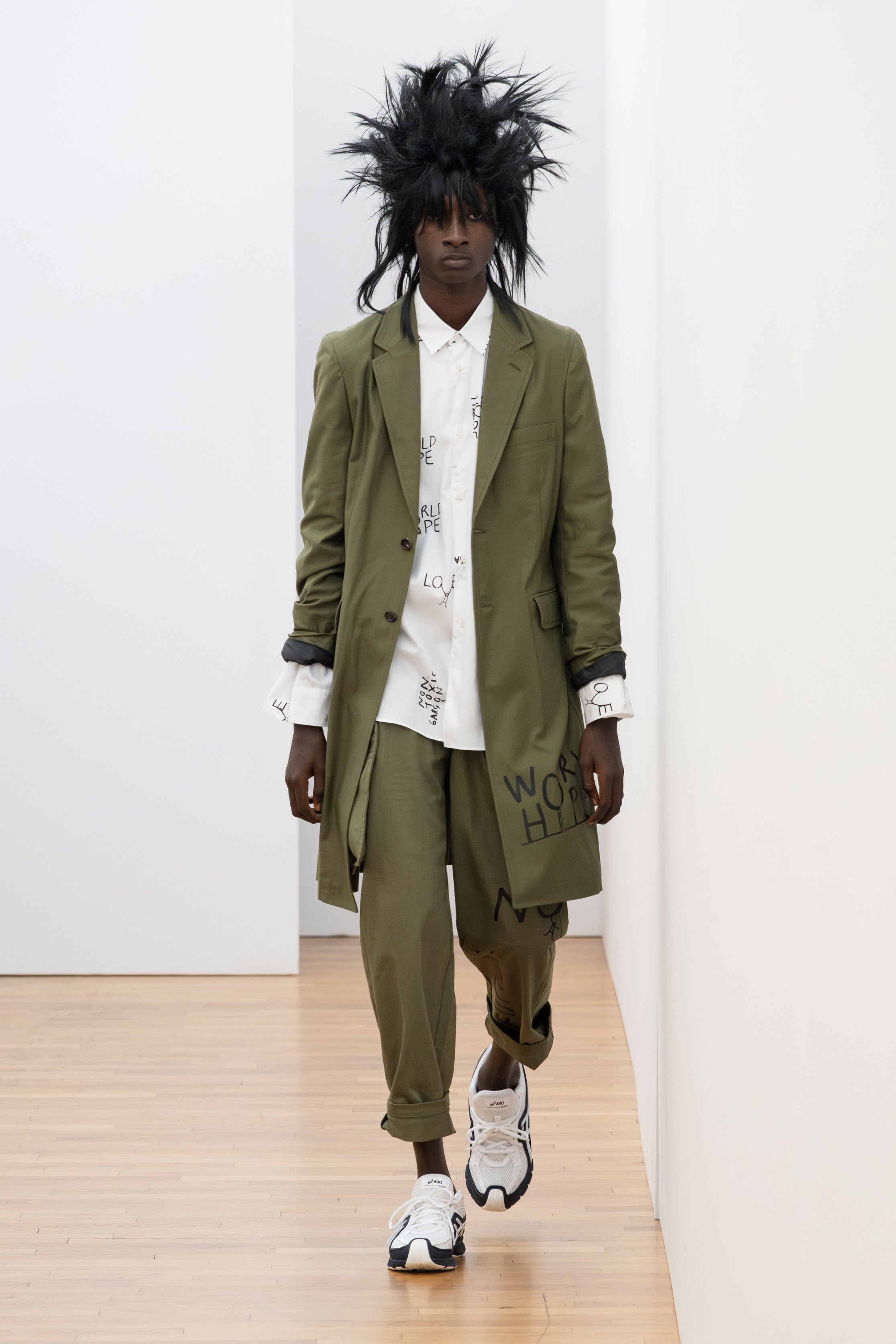 Fashion model wearing a Comme des Garçons Shirt SS26 outfit