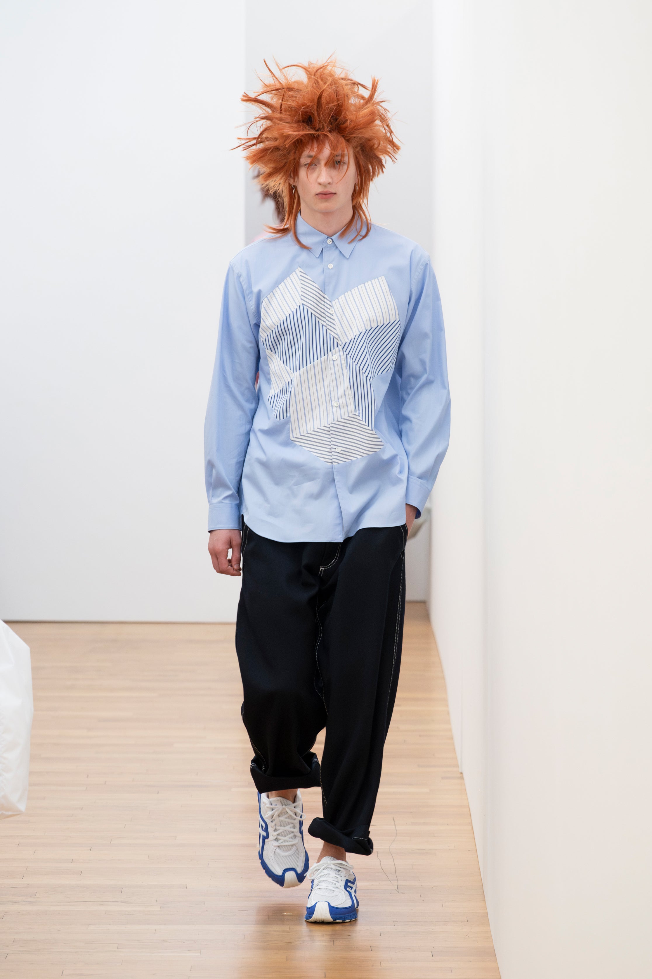 Fashion model wearing a Comme des Garçons Shirt SS26 outfit