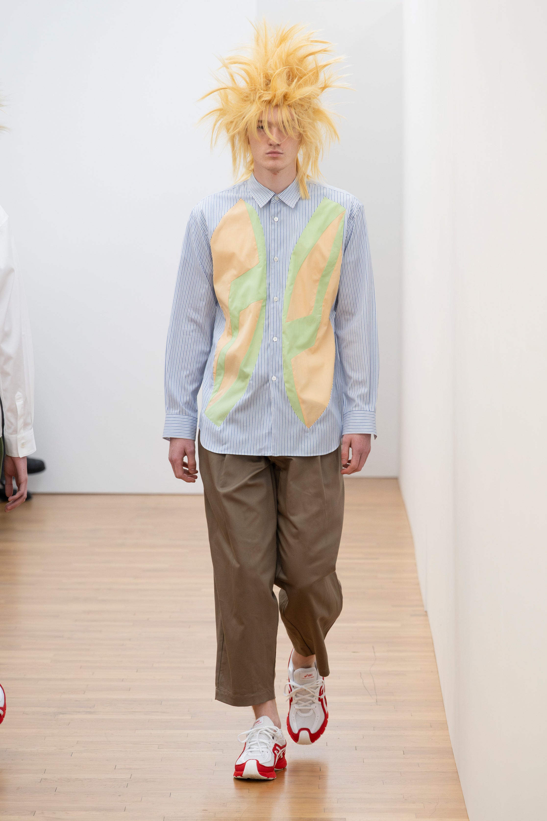 Fashion model wearing a Comme des Garçons Shirt SS26 outfit