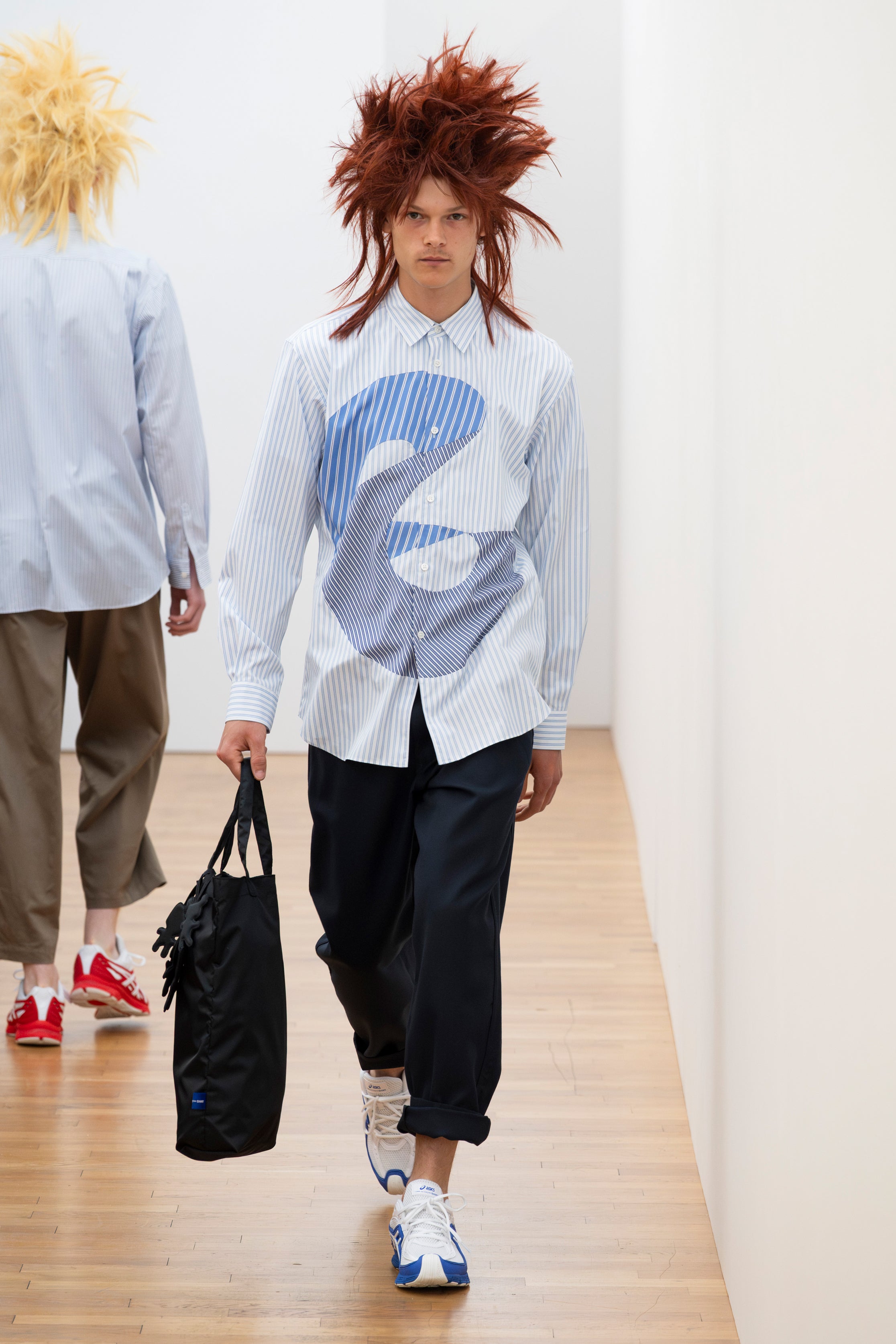 Fashion model wearing a Comme des Garçons Shirt SS26 outfit