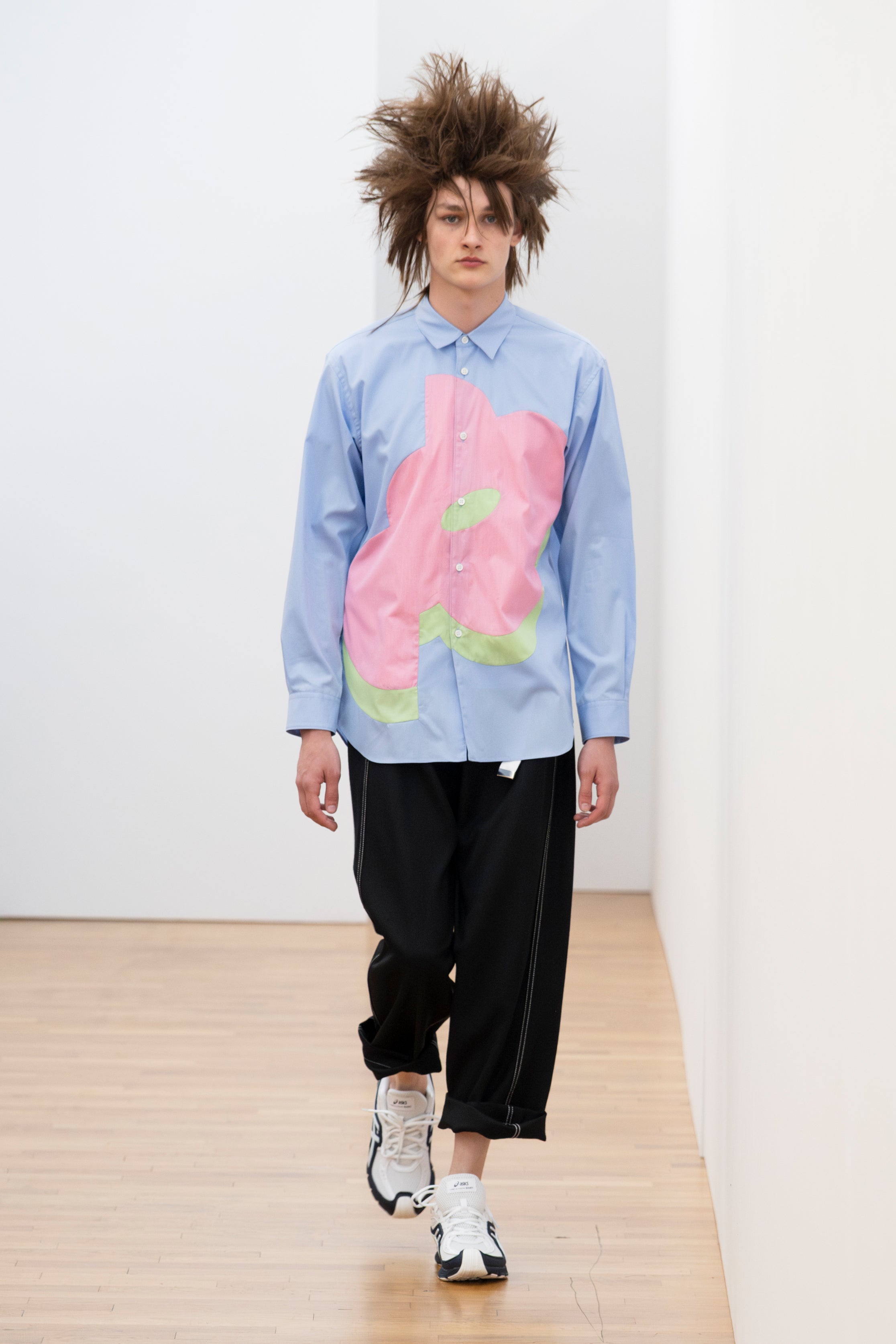 Fashion model wearing a Comme des Garçons Shirt SS26 outfit