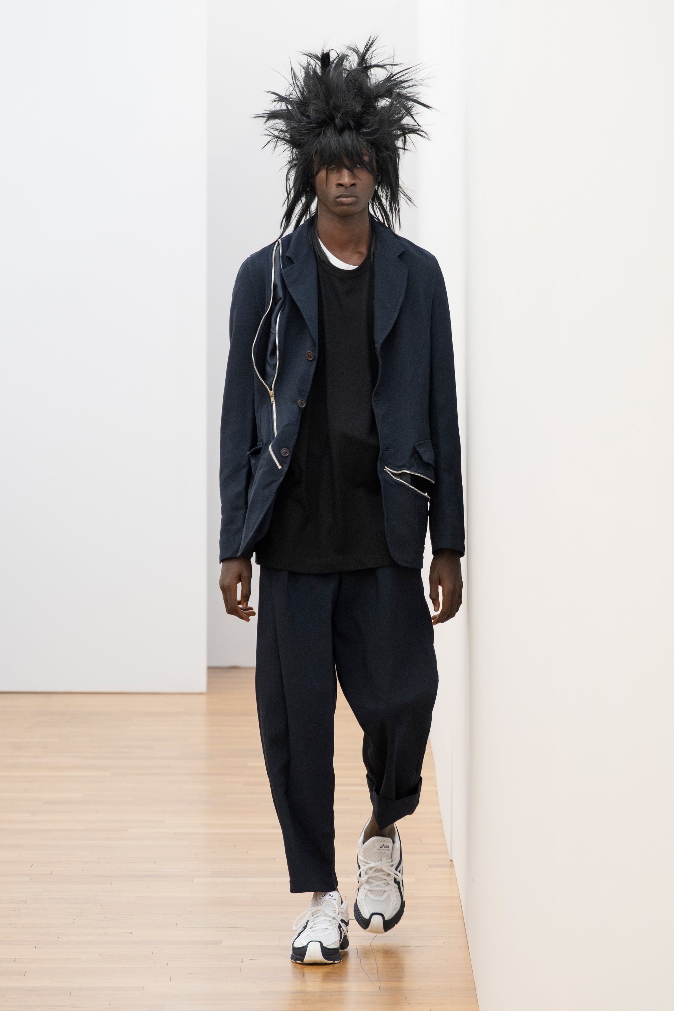 Fashion model wearing a Comme des Garçons Shirt SS26 outfit