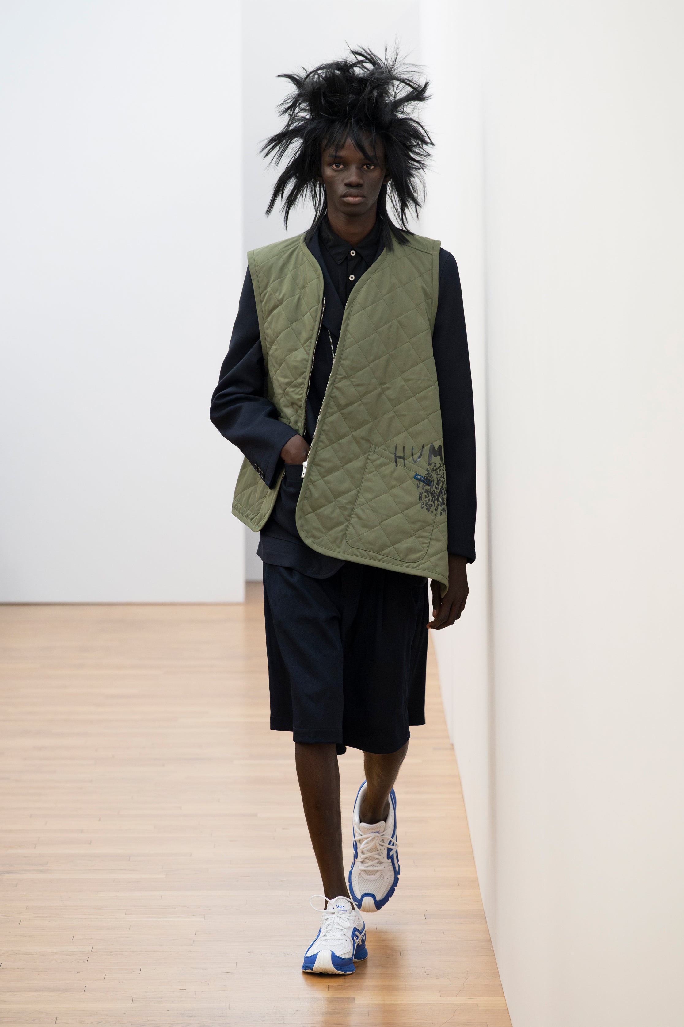 Fashion model wearing a Comme des Garçons Shirt SS26 outfit