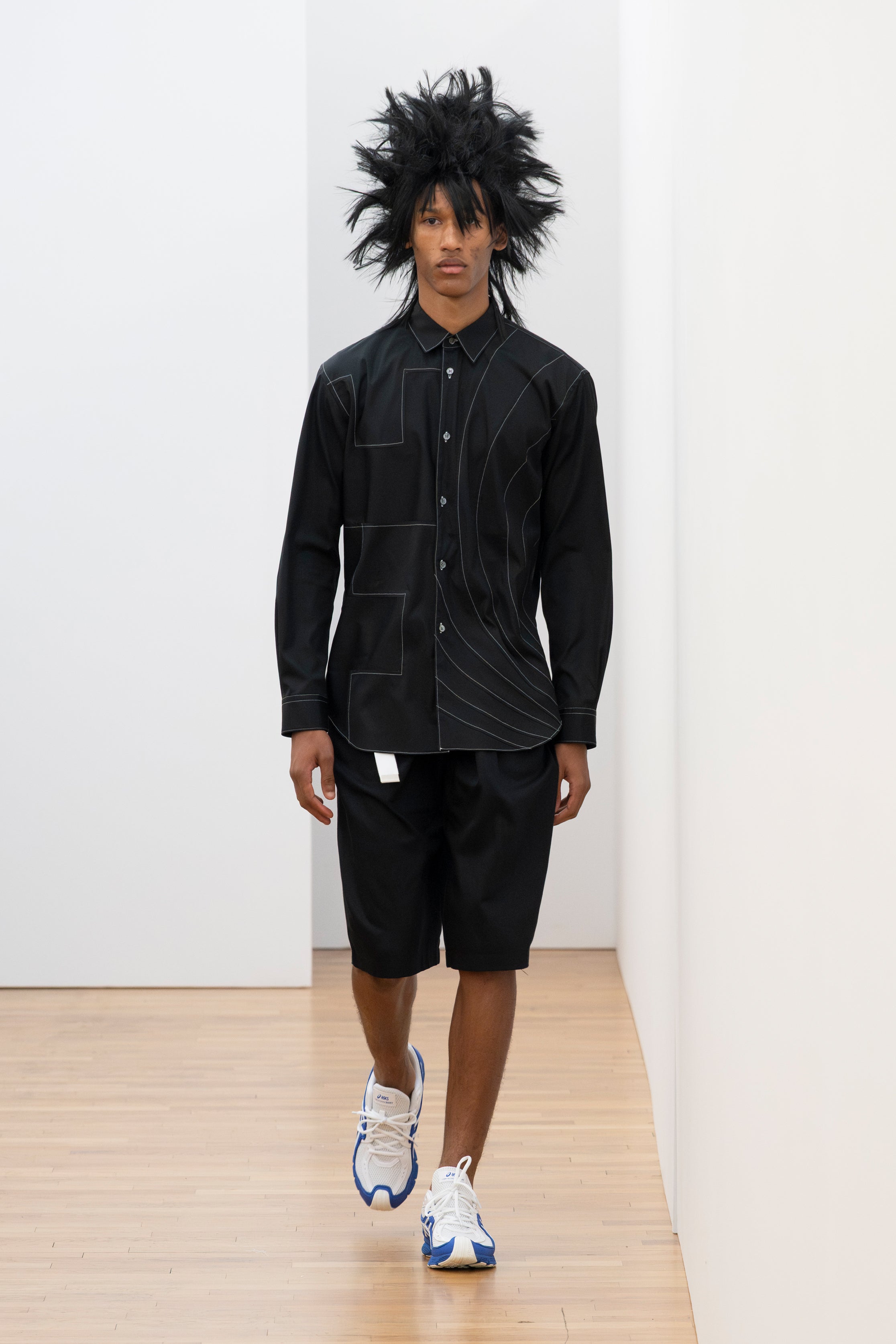 Fashion model wearing a Comme des Garçons Shirt SS26 outfit