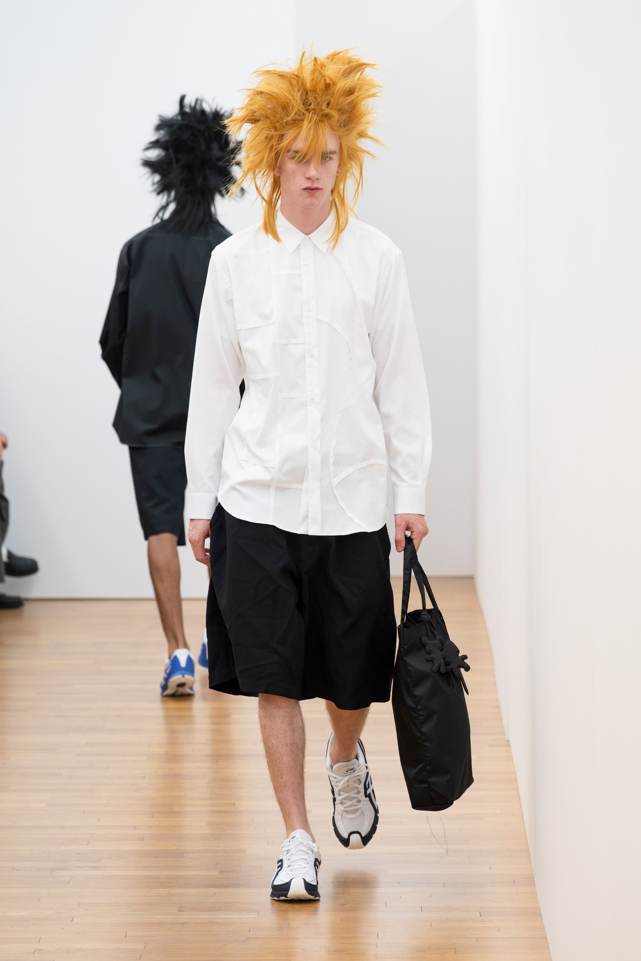 Fashion model wearing a Comme des Garçons Shirt SS26 outfit