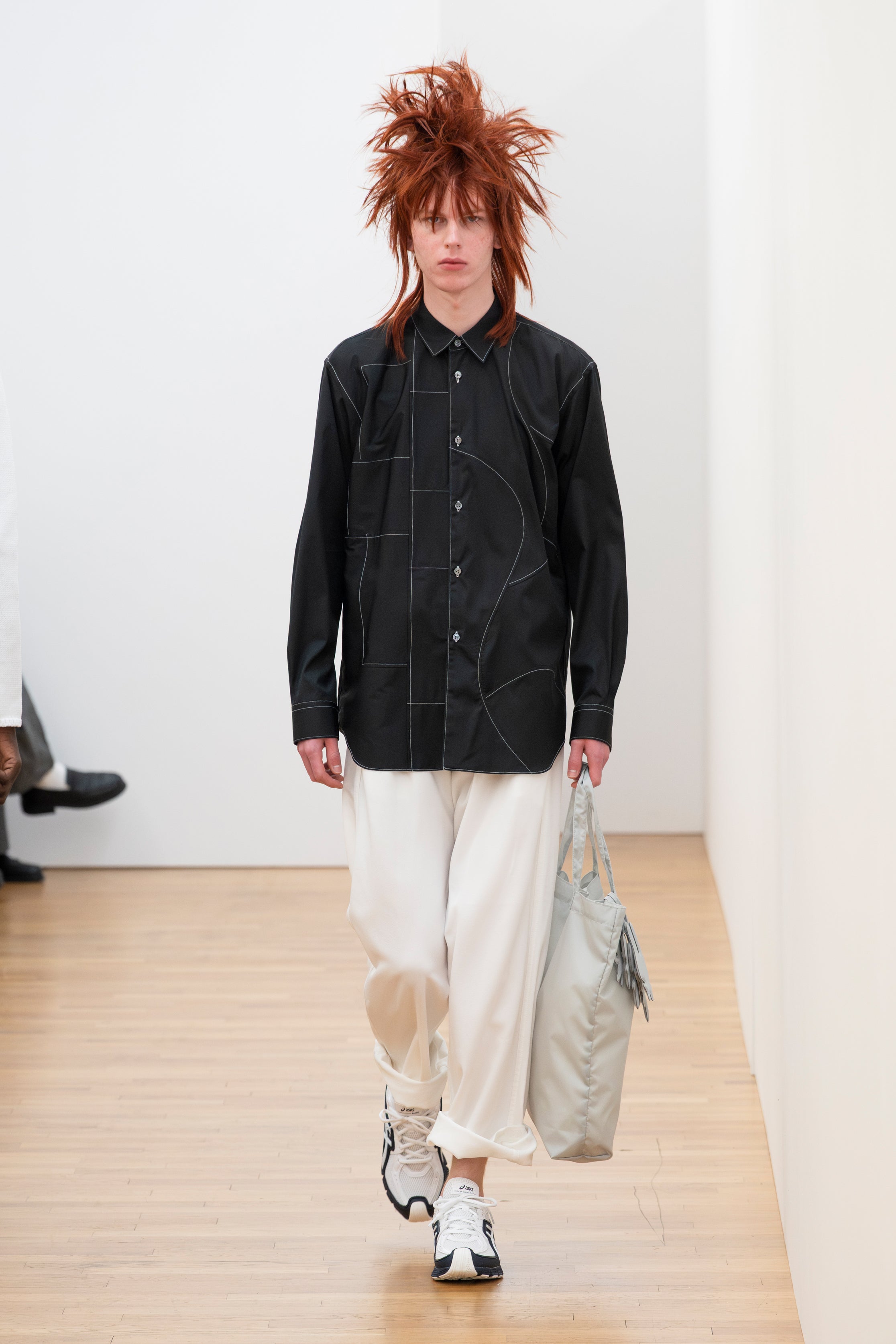 Fashion model wearing a Comme des Garçons Shirt SS26 outfit