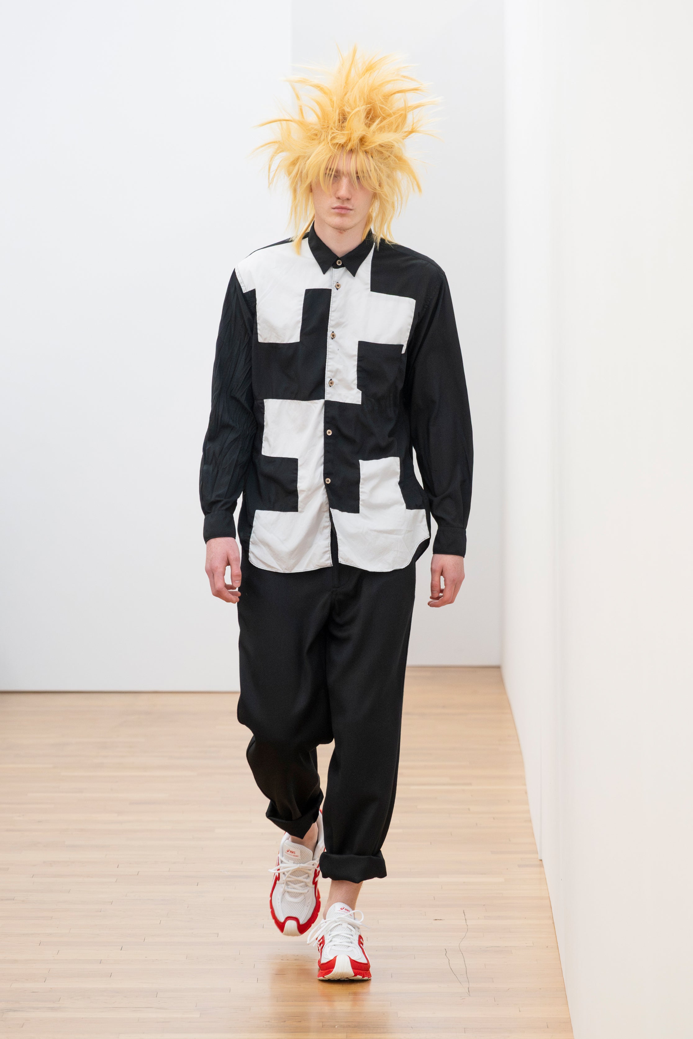 Fashion model wearing a Comme des Garçons Shirt SS26 outfit