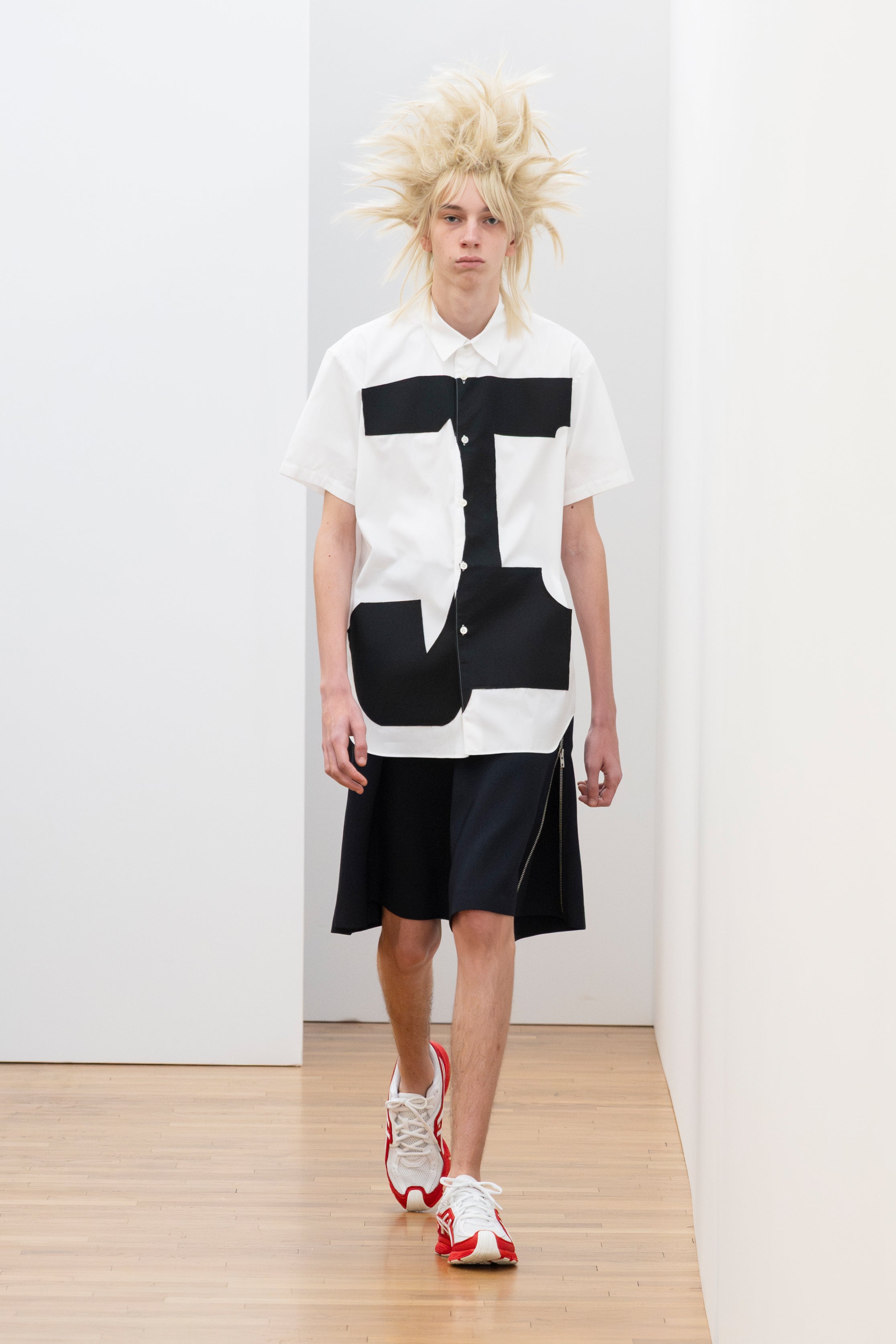 Fashion model wearing a Comme des Garçons Shirt SS26 outfit