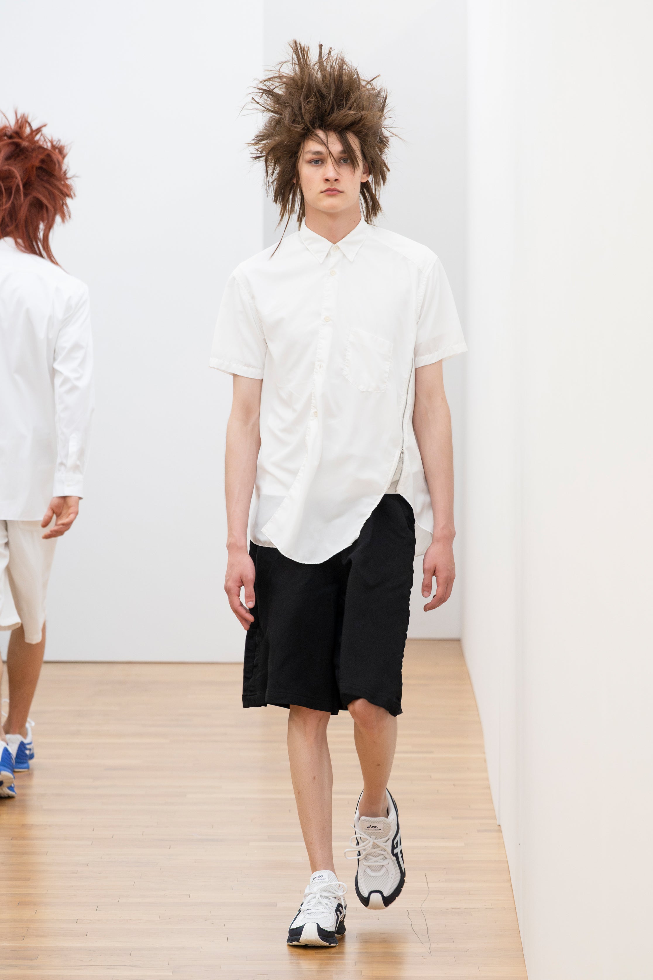 Fashion model wearing a Comme des Garçons Shirt SS26 outfit
