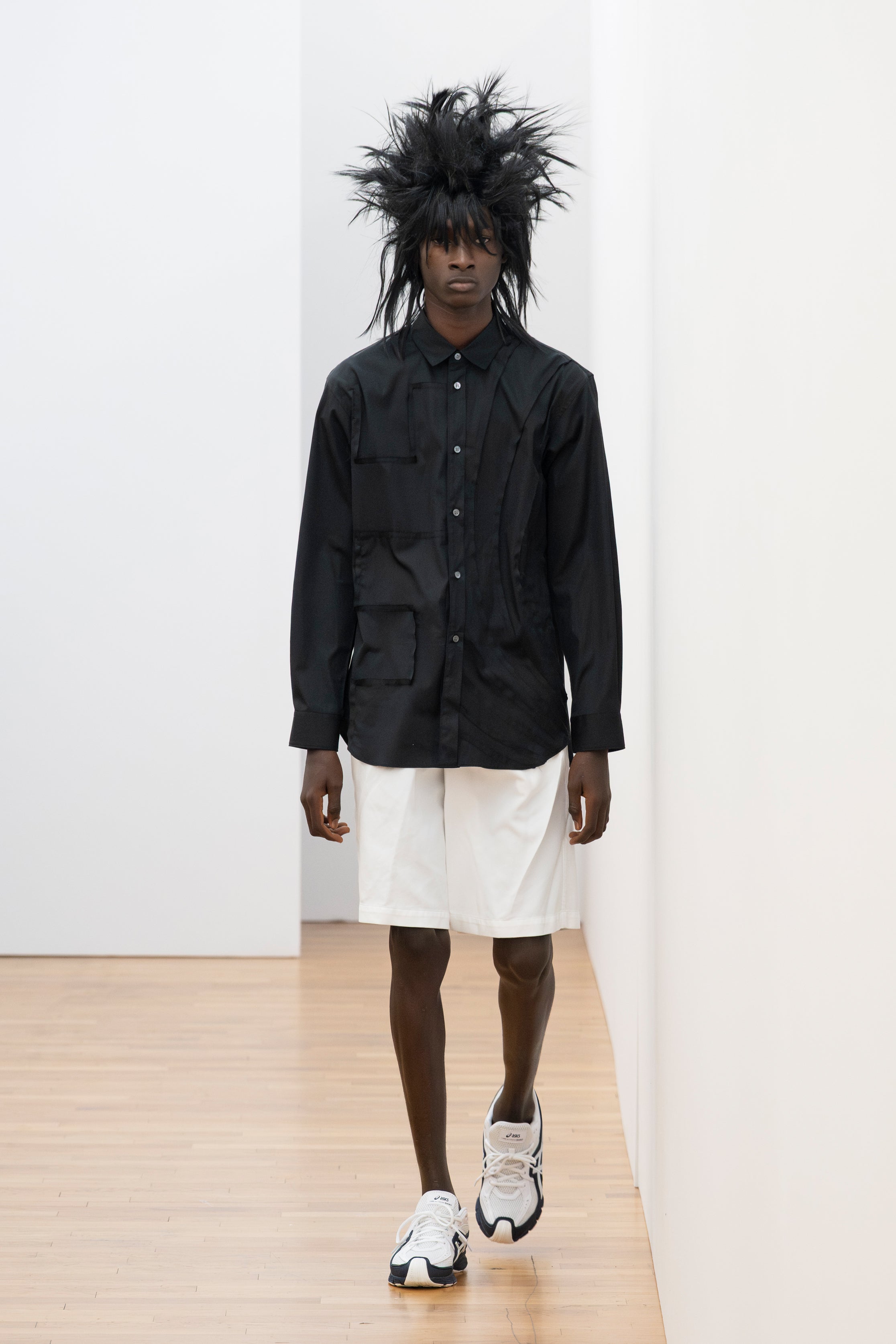 Fashion model wearing a Comme des Garçons Shirt SS26 outfit