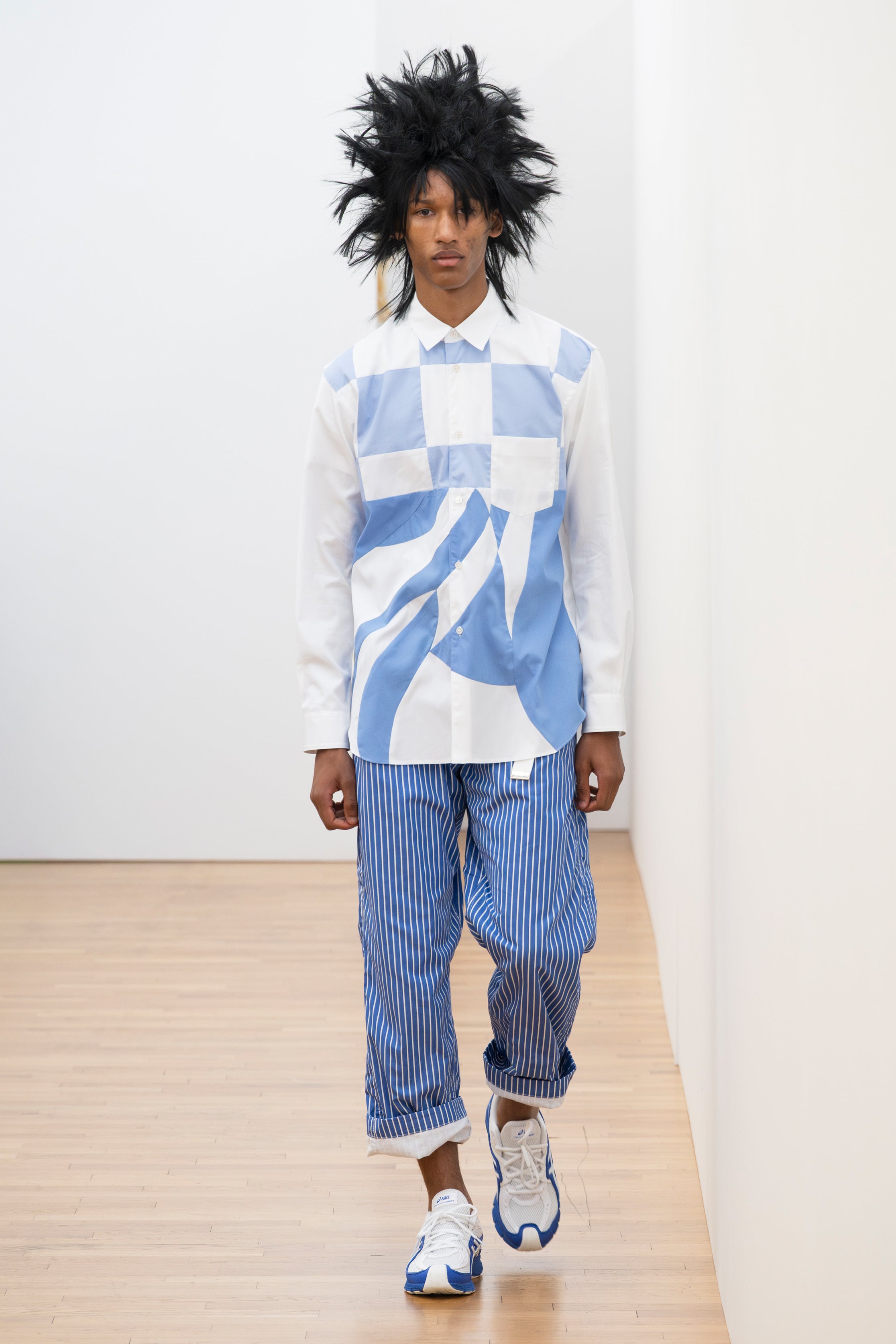 Fashion model wearing a Comme des Garçons Shirt SS26 outfit