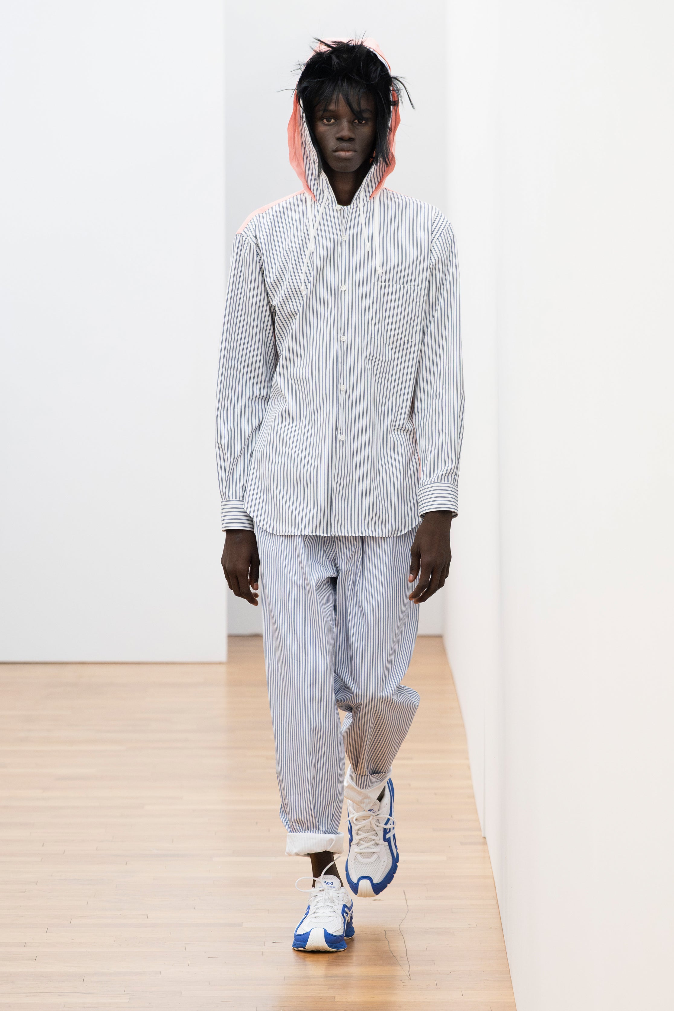 Fashion model wearing a Comme des Garçons Shirt SS26 outfit