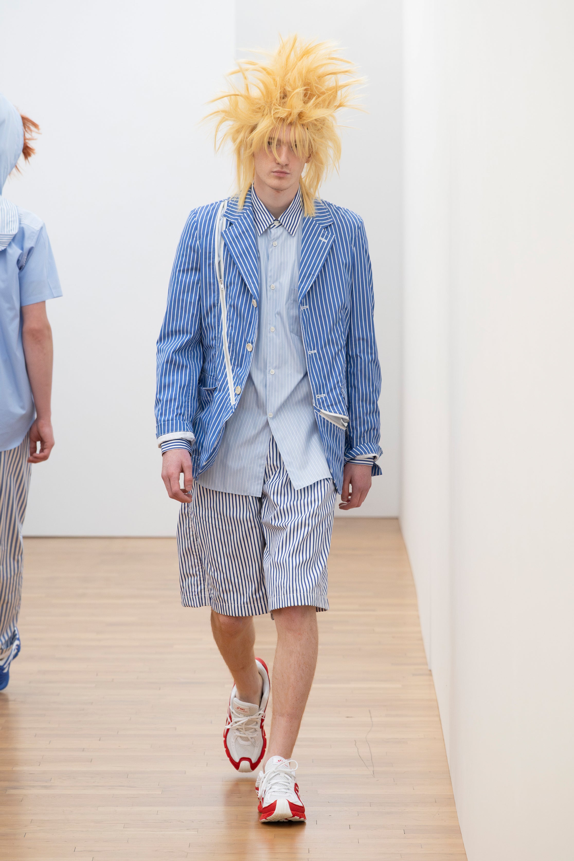 Fashion model wearing a Comme des Garçons Shirt SS26 outfit