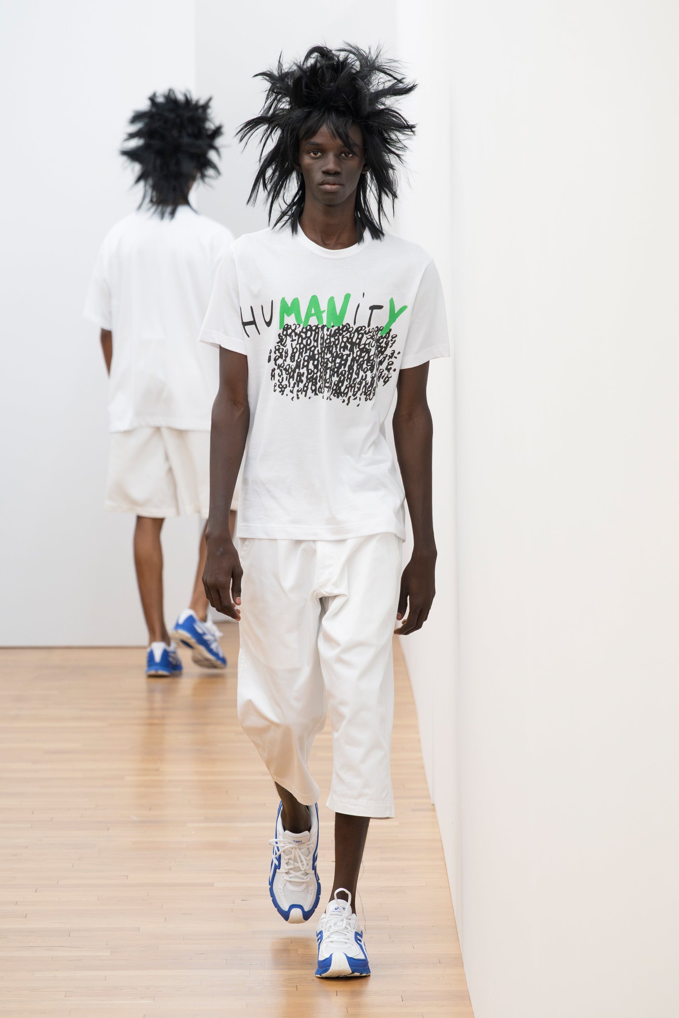 Fashion model wearing a Comme des Garçons Shirt SS26 outfit