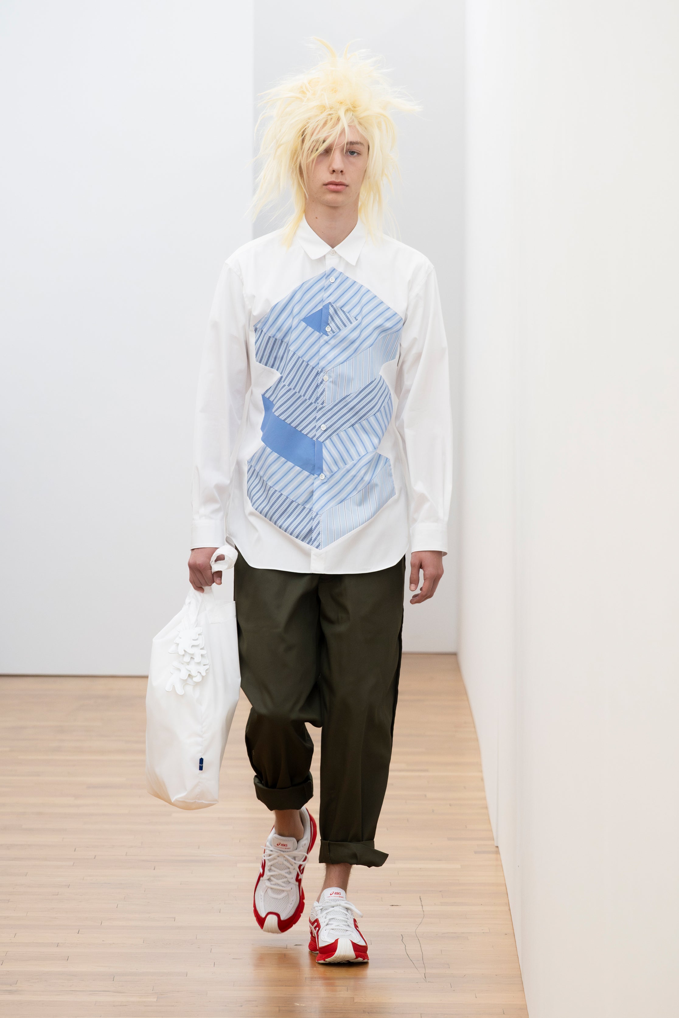 Fashion model wearing a Comme des Garçons Shirt SS26 outfit