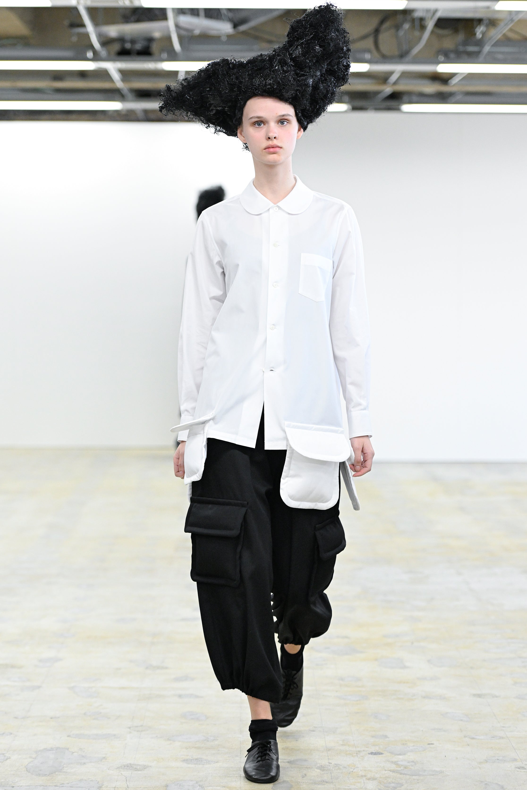 Fashion model wearing a Comme des Garçons Comme des Garçons AW25 outfit