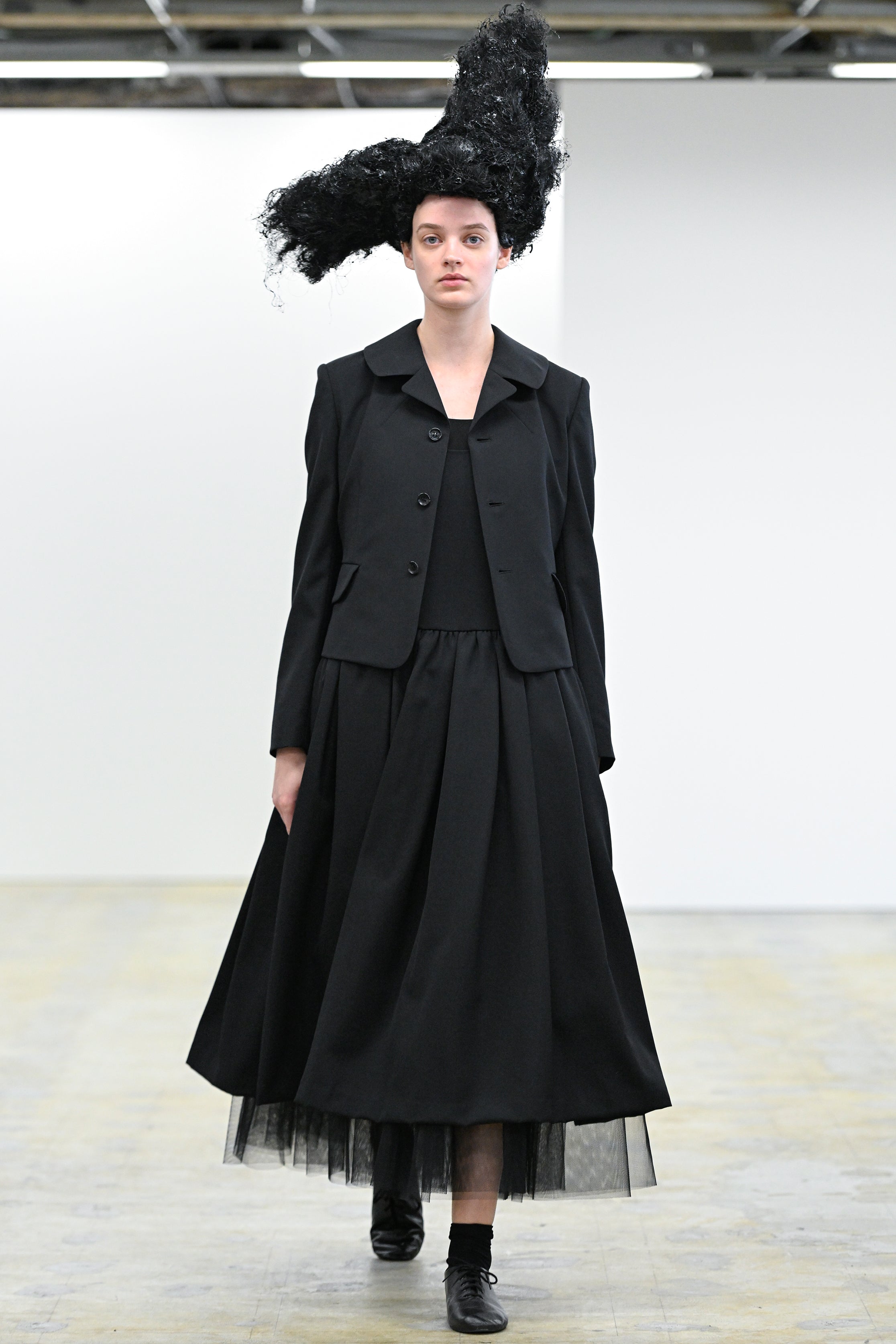 Fashion model wearing a Comme des Garçons Comme des Garçons AW25 outfit