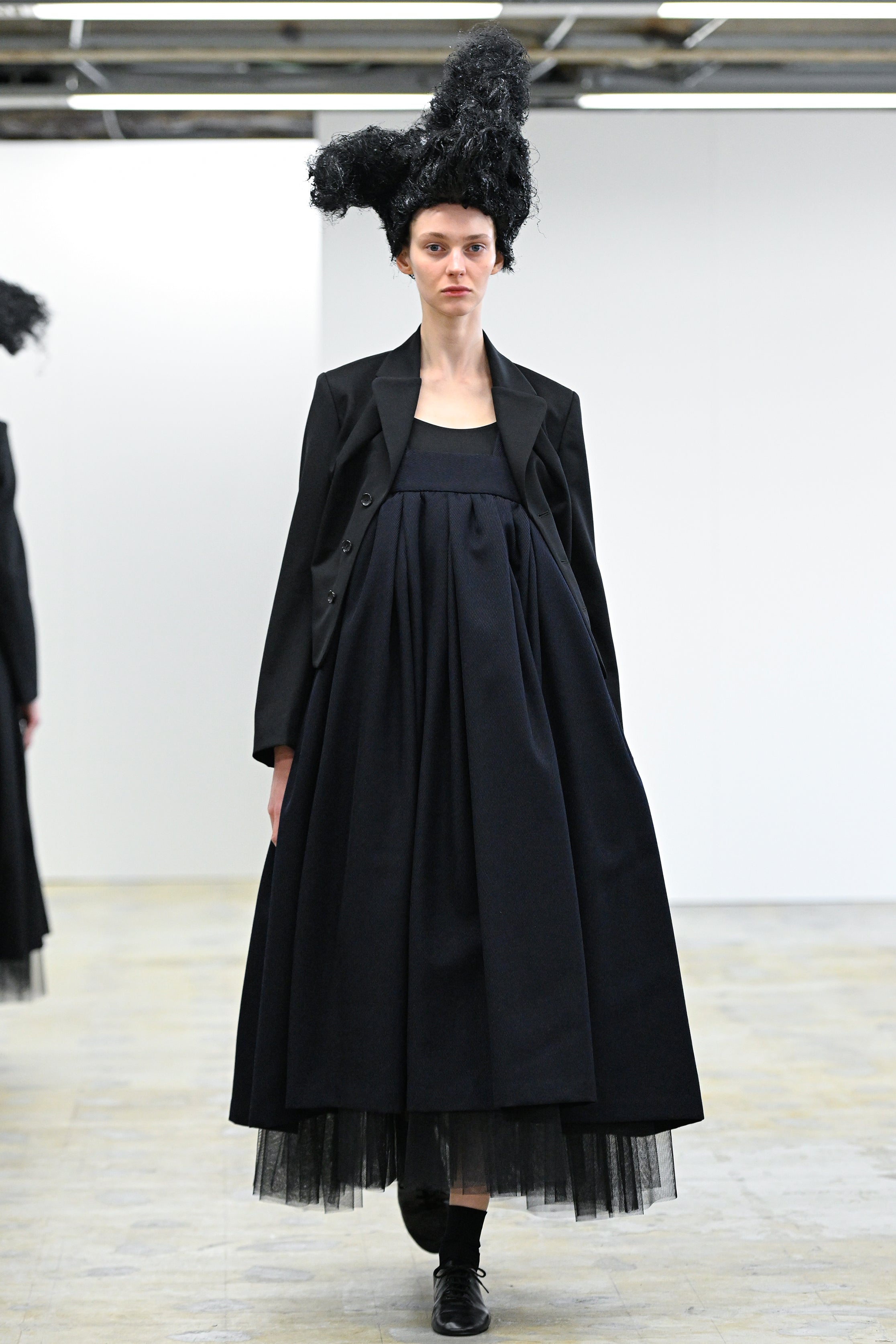 Fashion model wearing a Comme des Garçons Comme des Garçons AW25 outfit