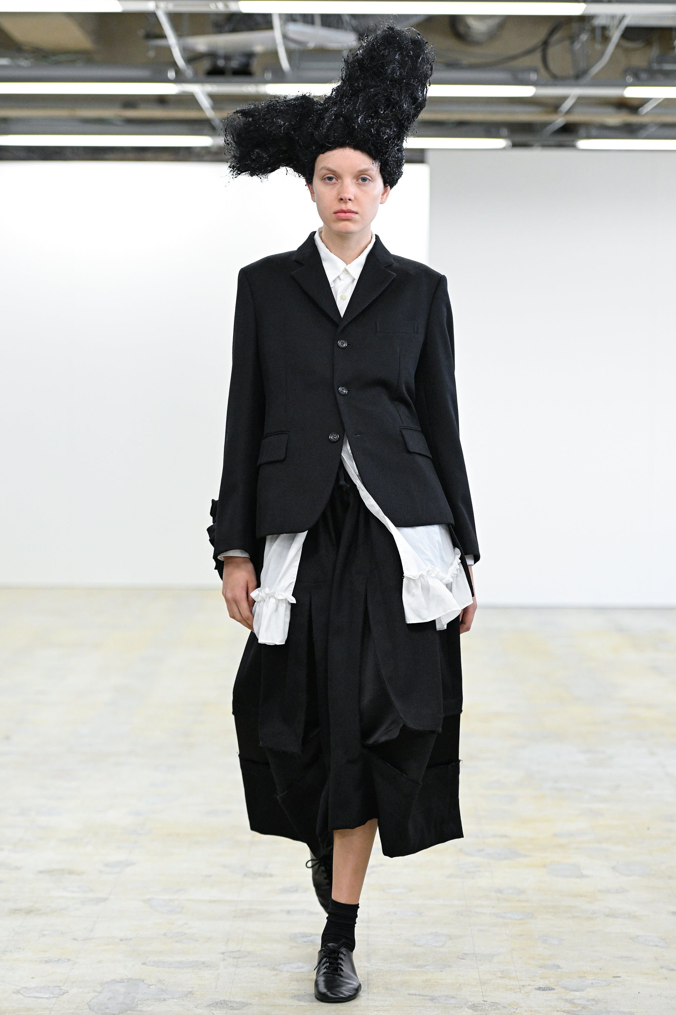 Fashion model wearing a Comme des Garçons Comme des Garçons AW25 outfit
