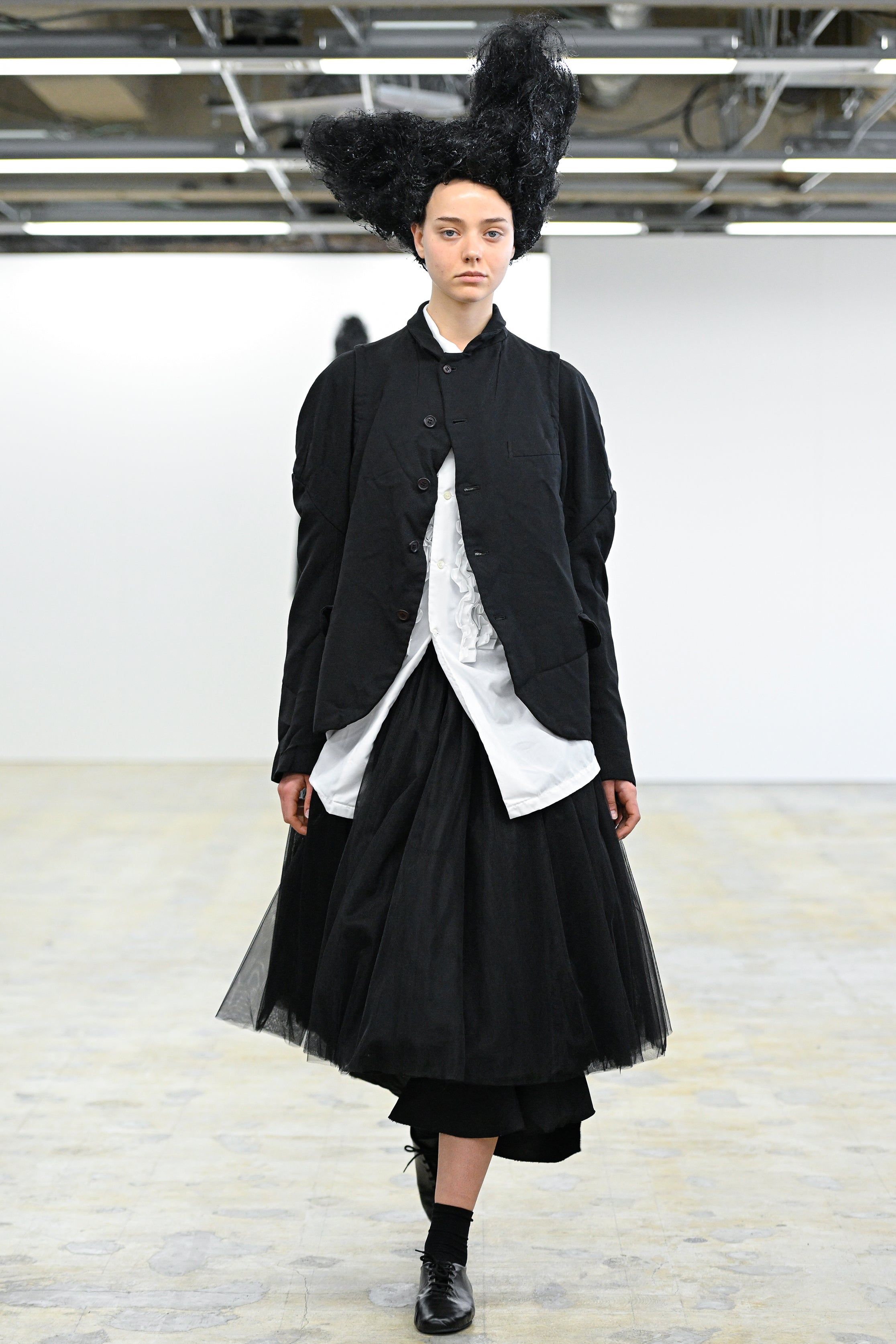 Fashion model wearing a Comme des Garçons Comme des Garçons AW25 outfit