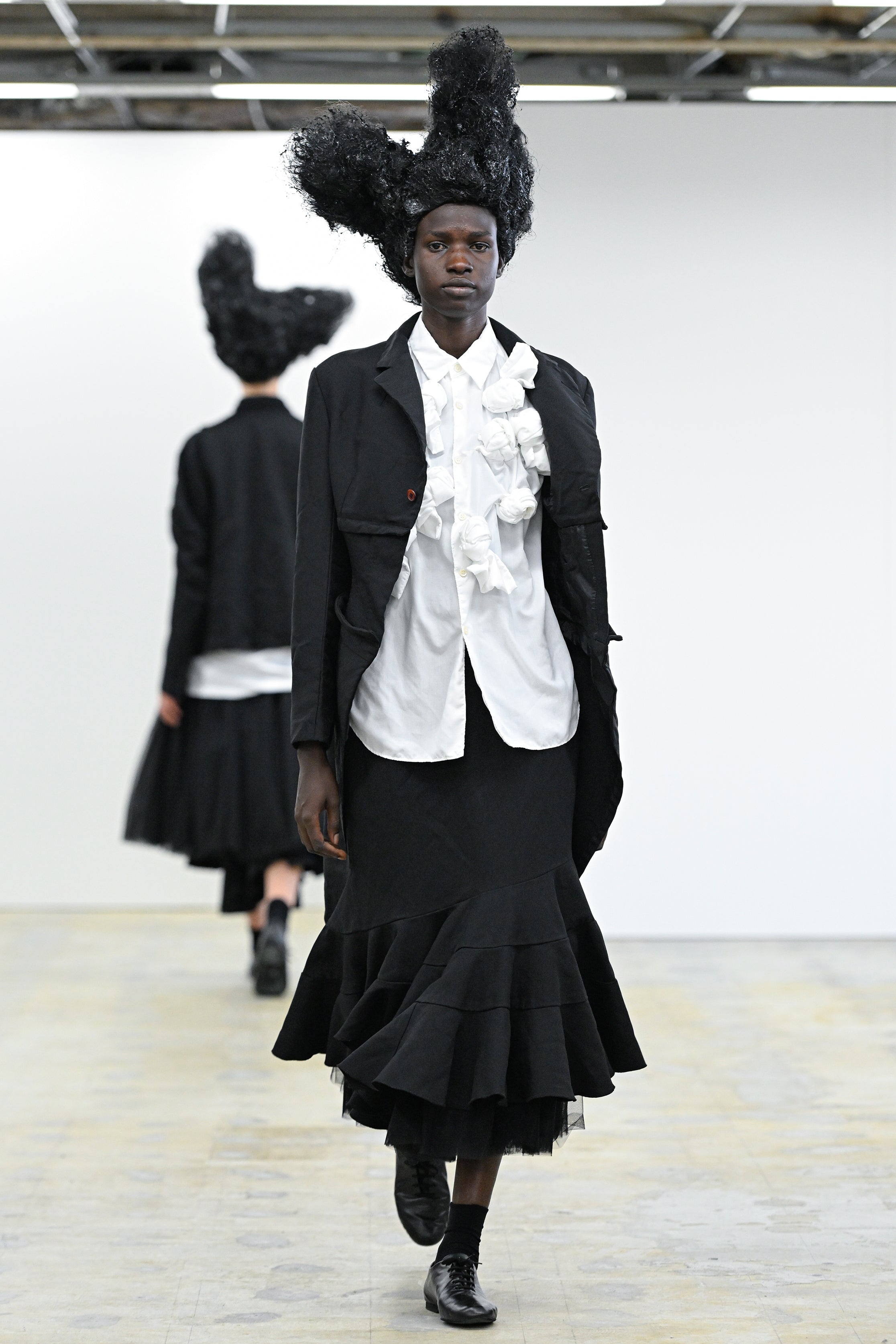 Fashion model wearing a Comme des Garçons Comme des Garçons AW25 outfit