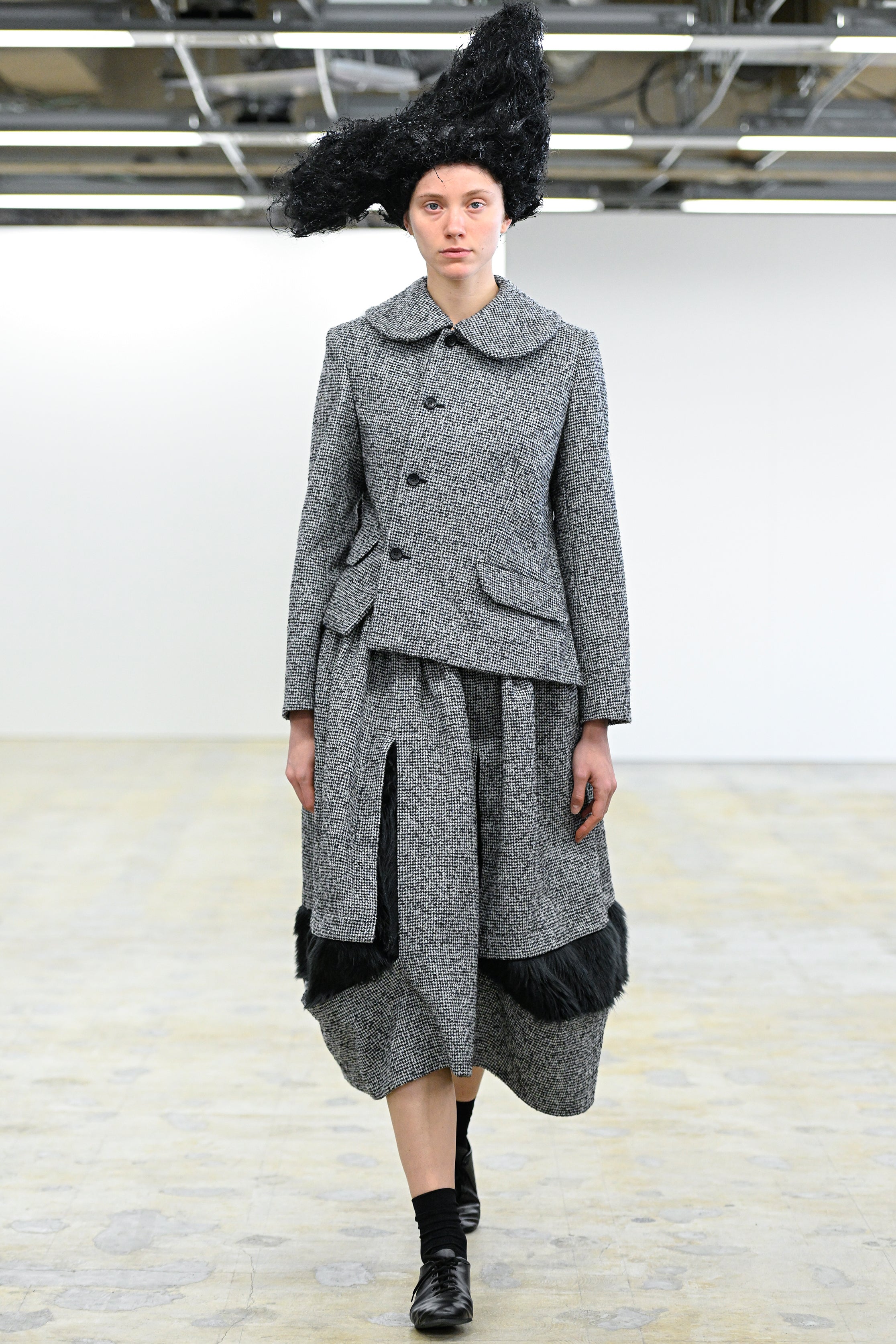Fashion model wearing a Comme des Garçons Comme des Garçons AW25 outfit