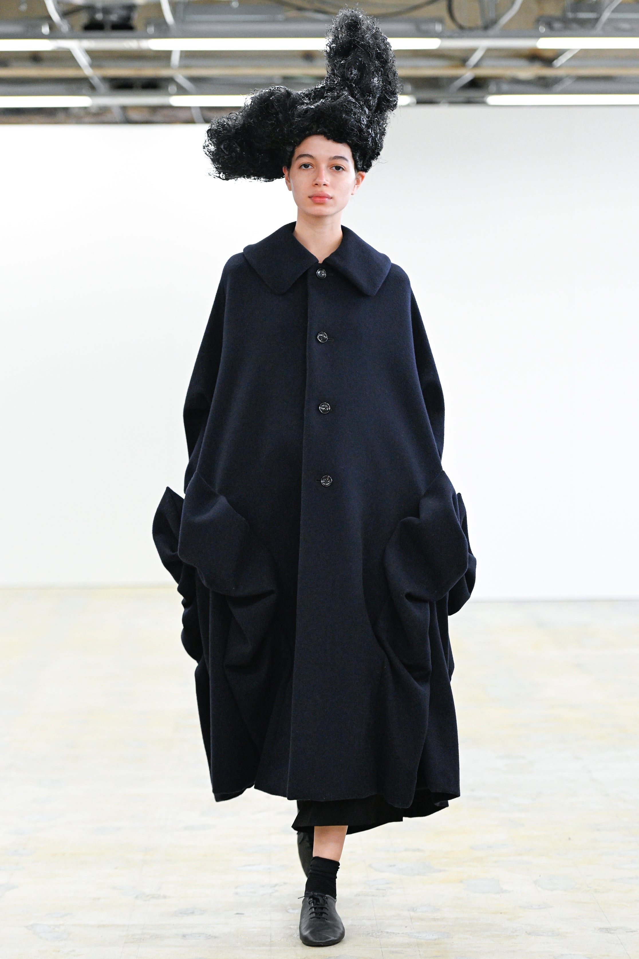 Fashion model wearing a Comme des Garçons Comme des Garçons AW25 outfit