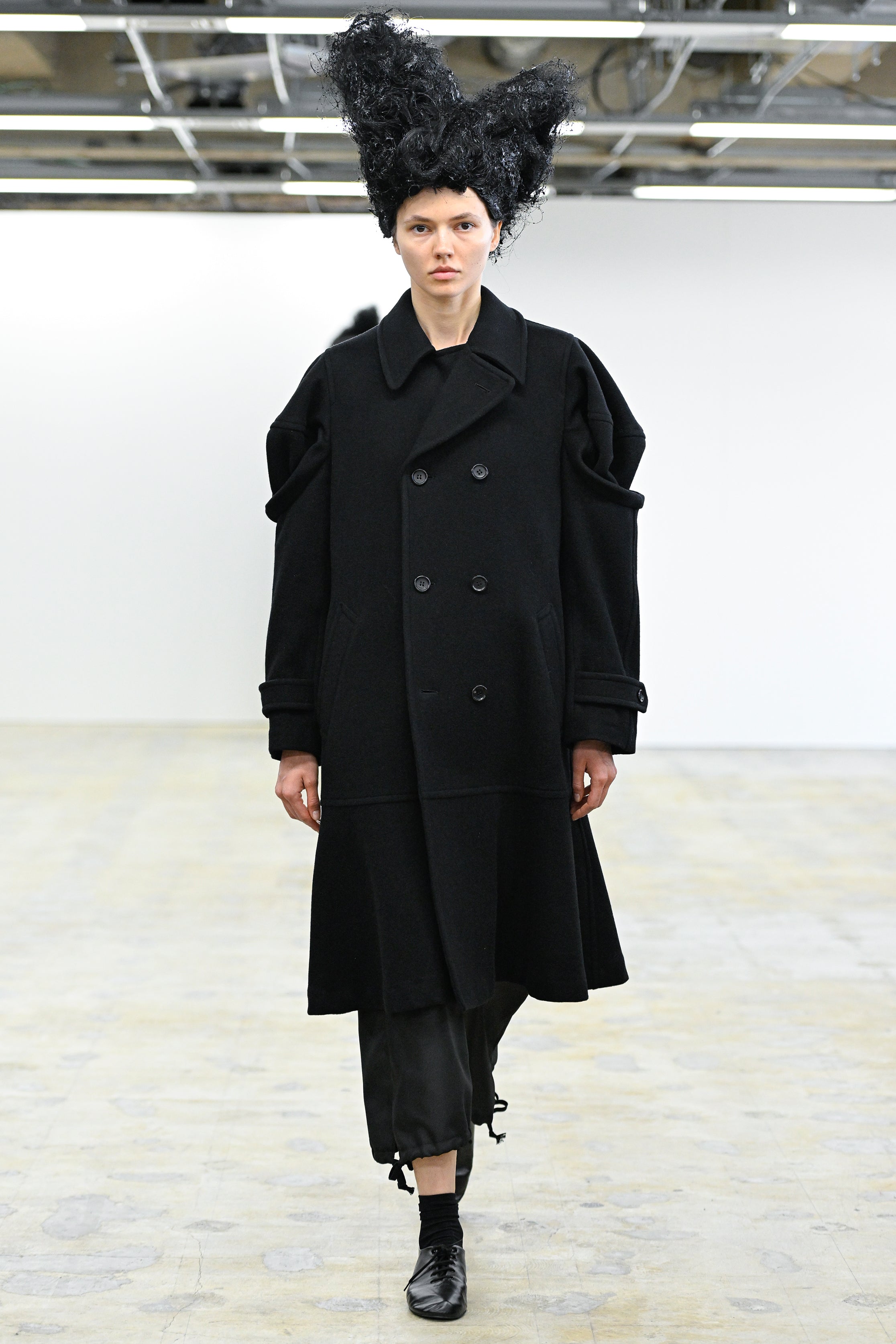 Fashion model wearing a Comme des Garçons Comme des Garçons AW25 outfit