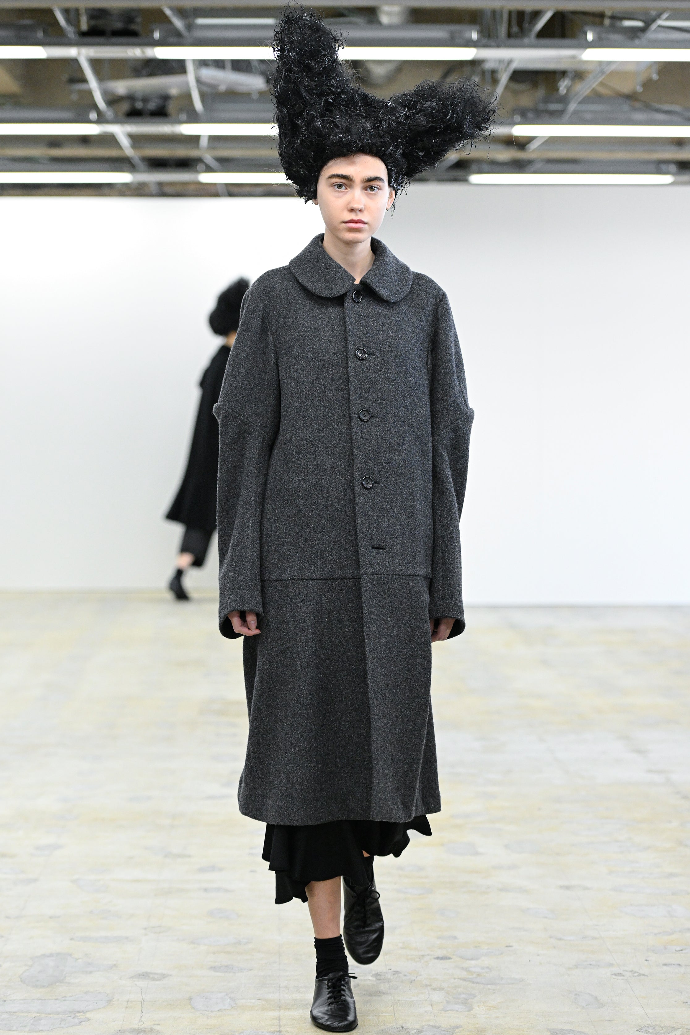Fashion model wearing a Comme des Garçons Comme des Garçons AW25 outfit