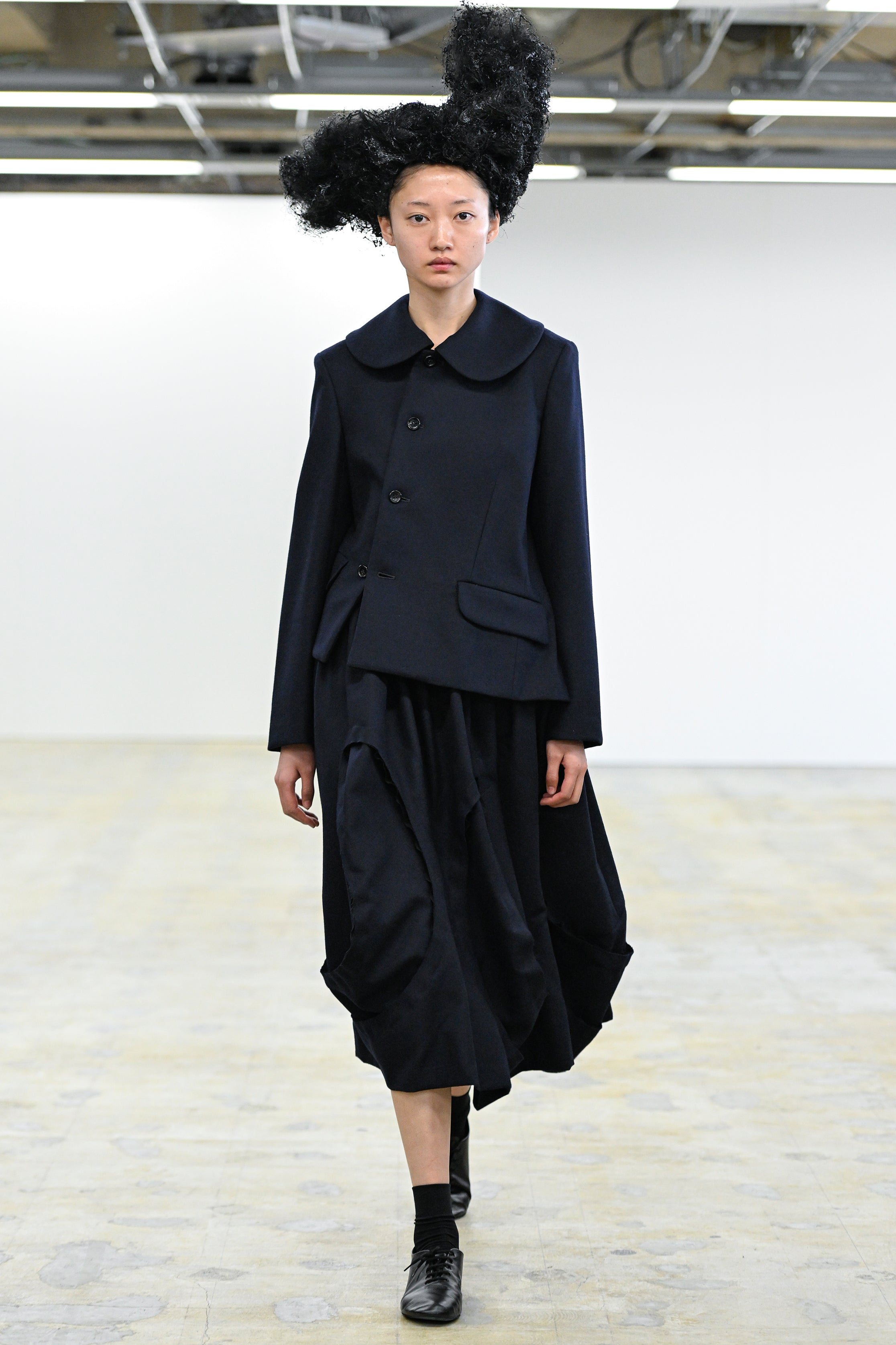Fashion model wearing a Comme des Garçons Comme des Garçons AW25 outfit