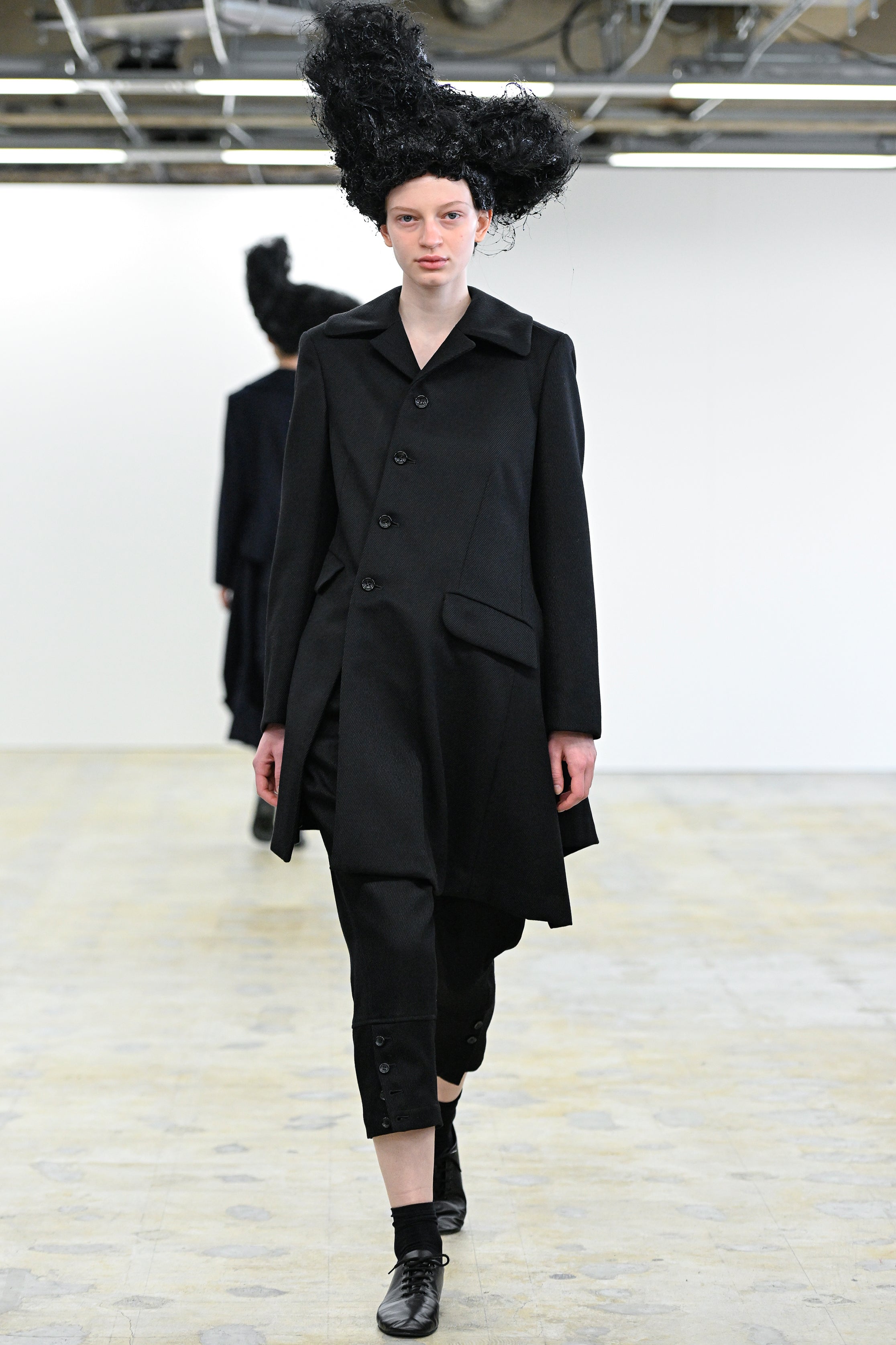 Fashion model wearing a Comme des Garçons Comme des Garçons AW25 outfit