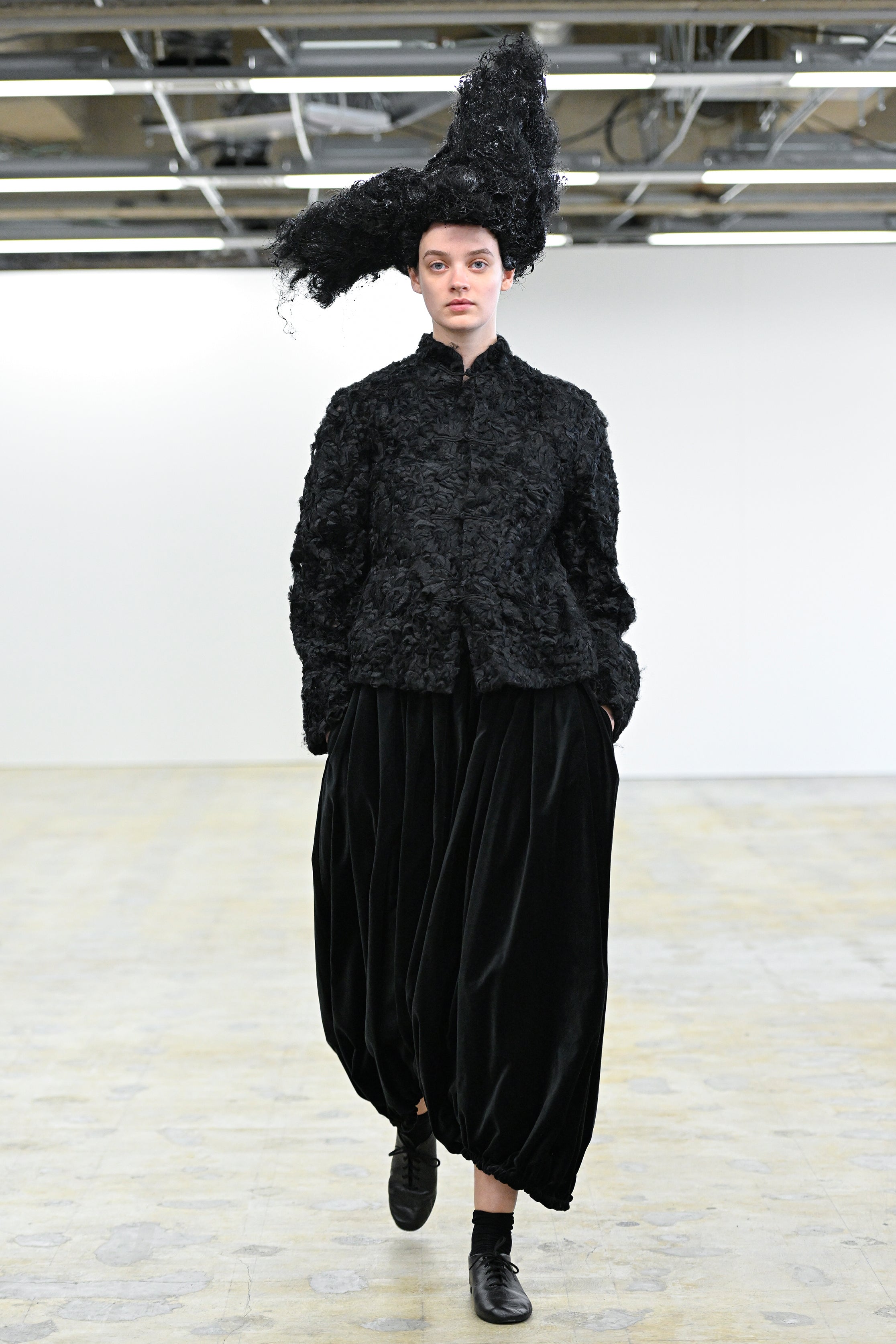 Fashion model wearing a Comme des Garçons Comme des Garçons AW25 outfit