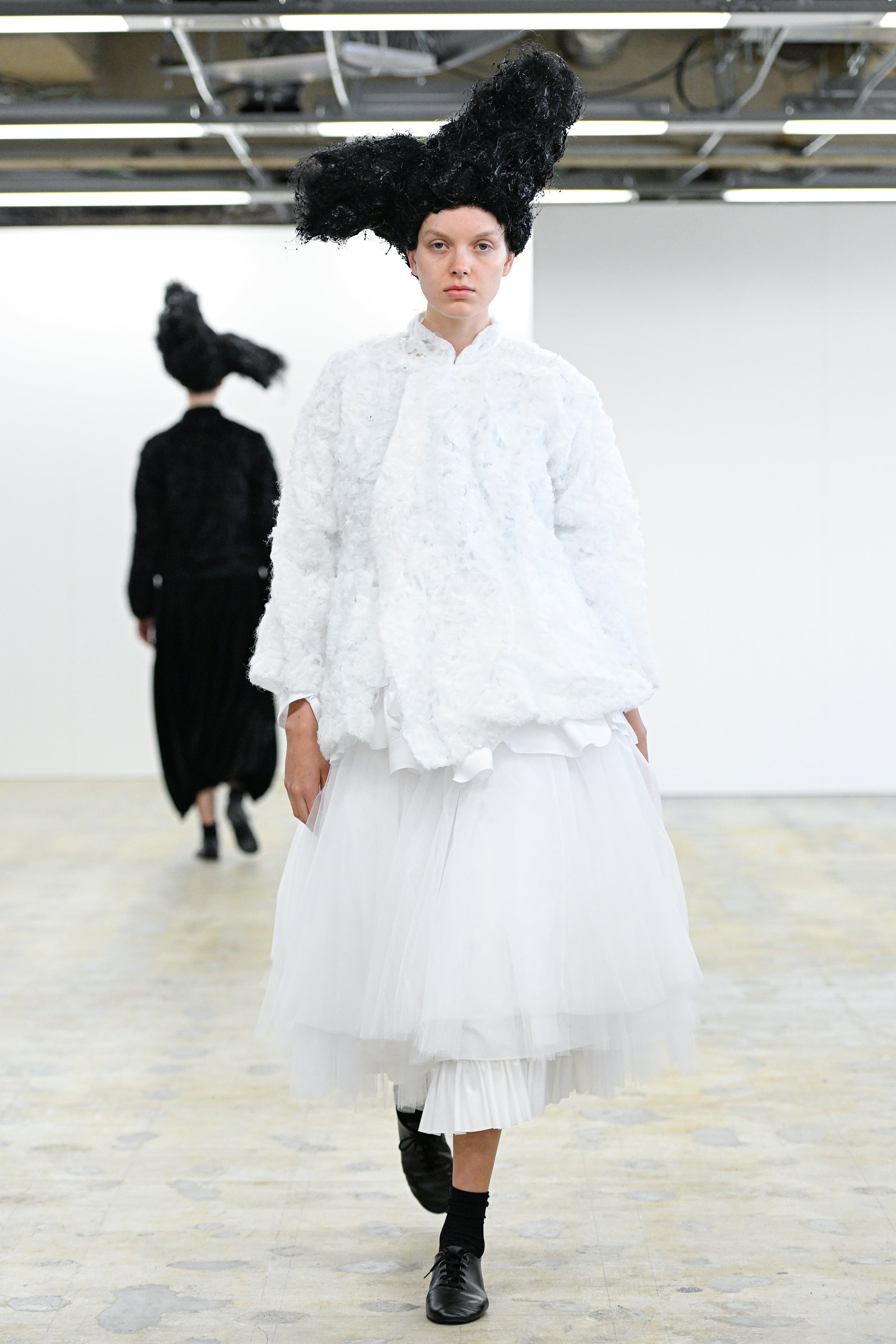 Fashion model wearing a Comme des Garçons Comme des Garçons AW25 outfit