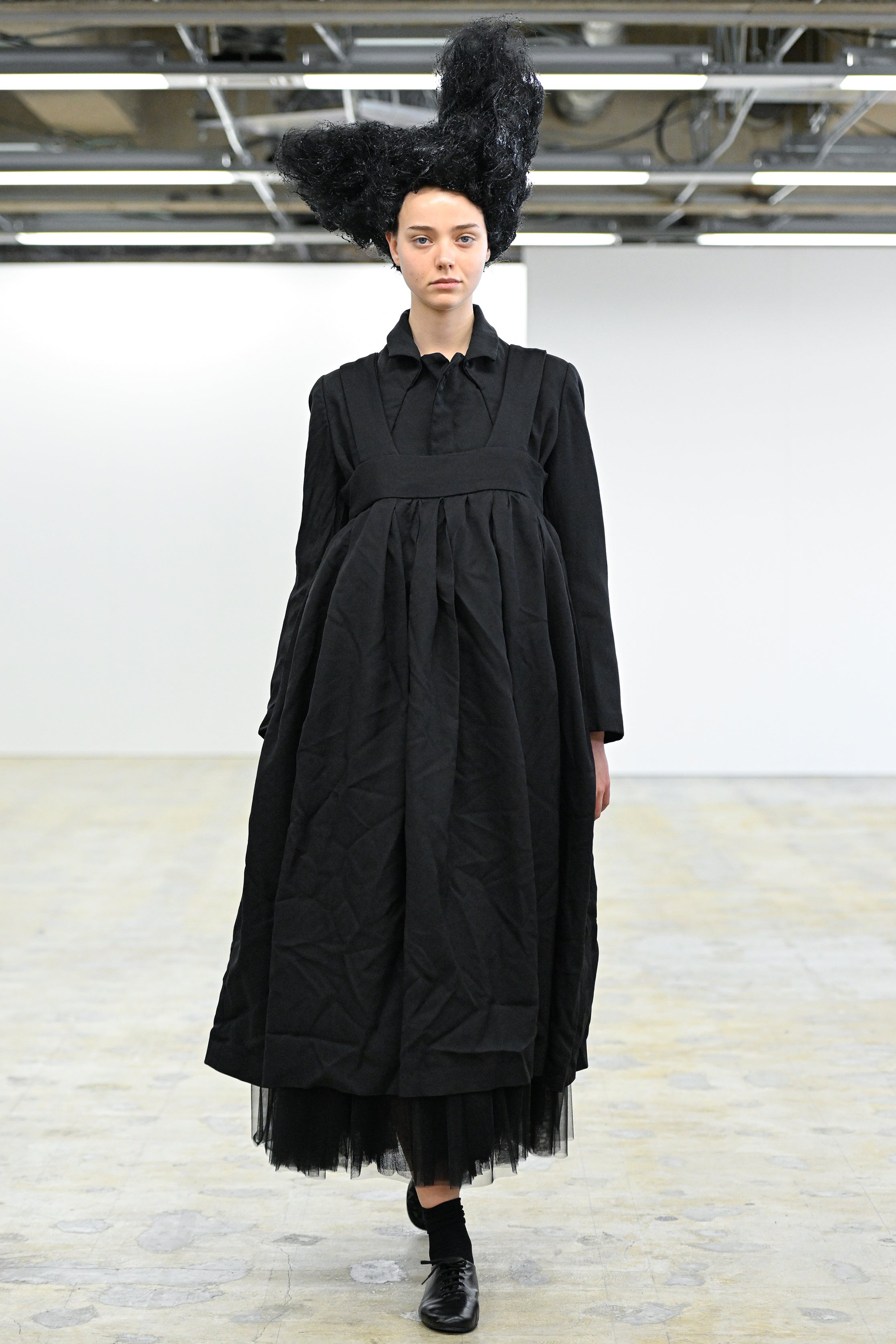 Fashion model wearing a Comme des Garçons Comme des Garçons AW25 outfit