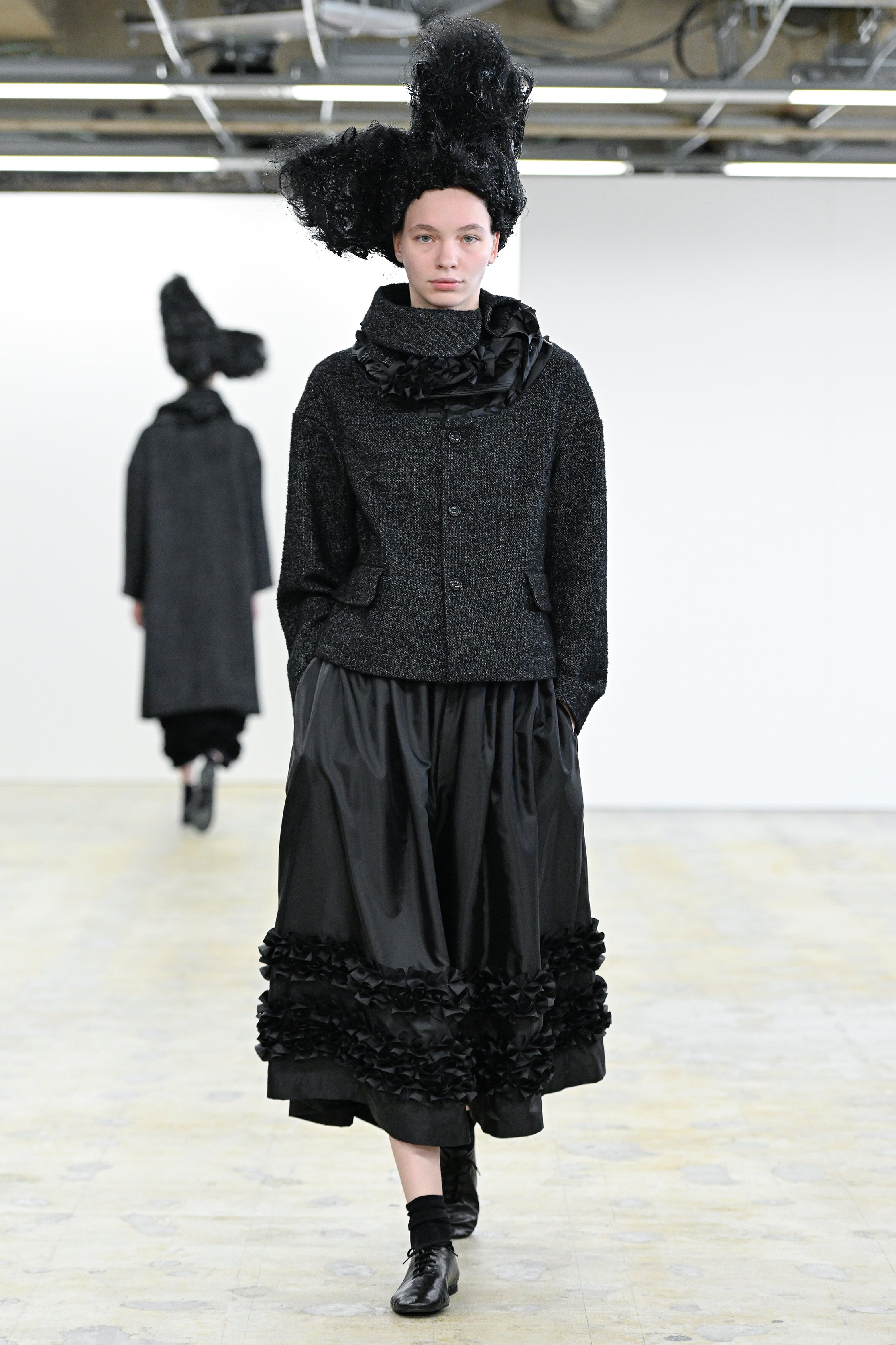 Fashion model wearing a Comme des Garçons Comme des Garçons AW25 outfit
