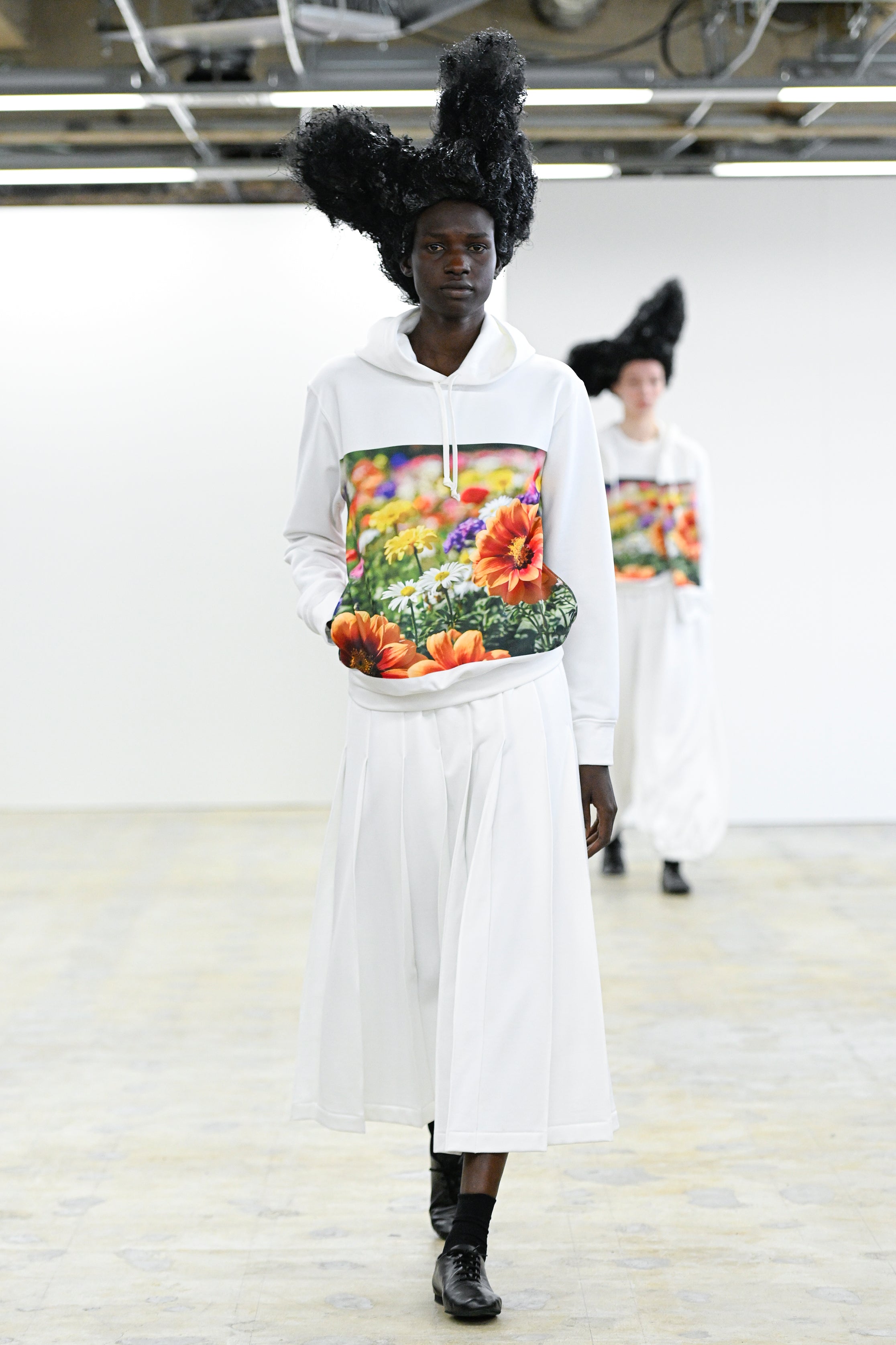 Fashion model wearing a Comme des Garçons Comme des Garçons AW25 outfit