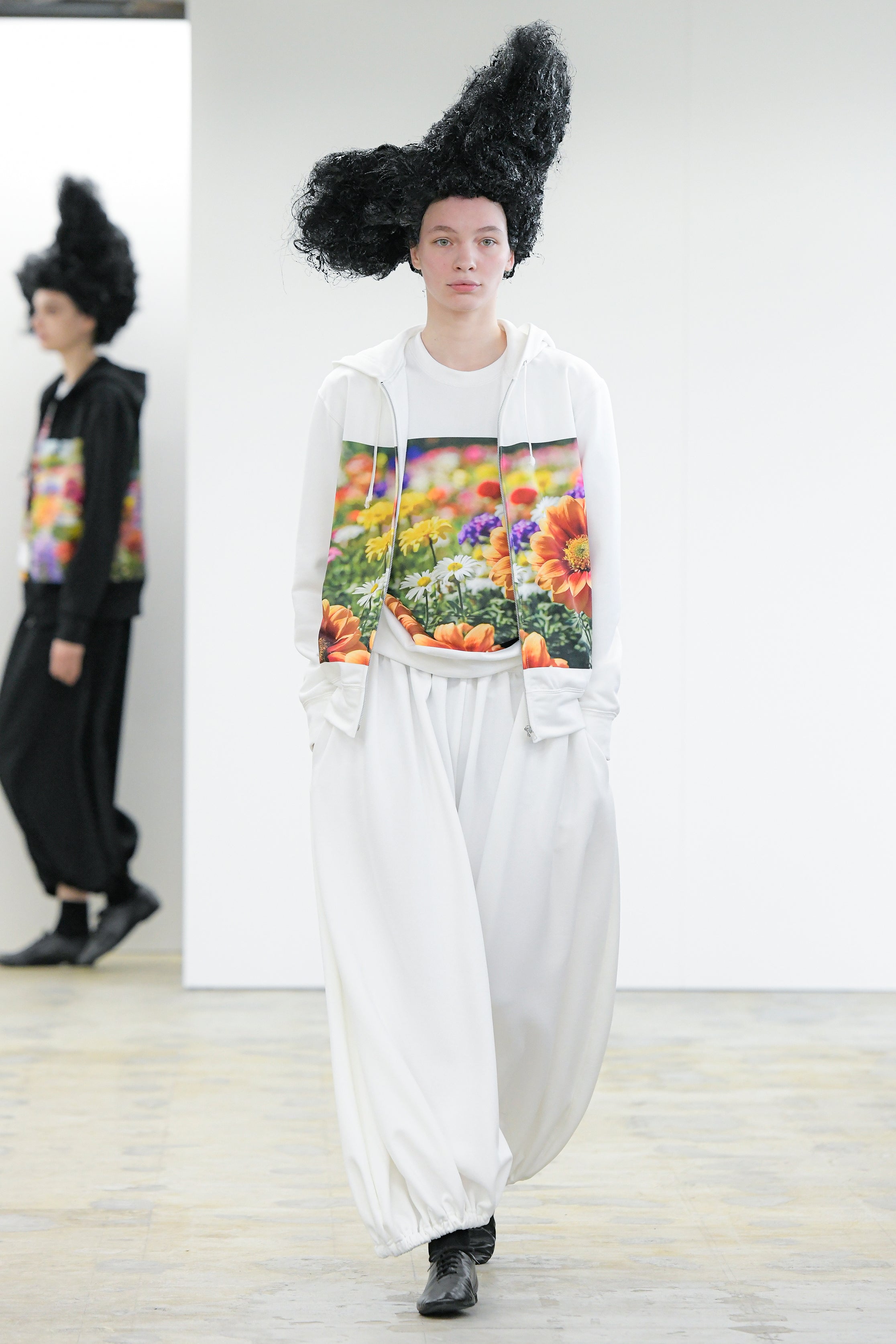 Fashion model wearing a Comme des Garçons Comme des Garçons AW25 outfit