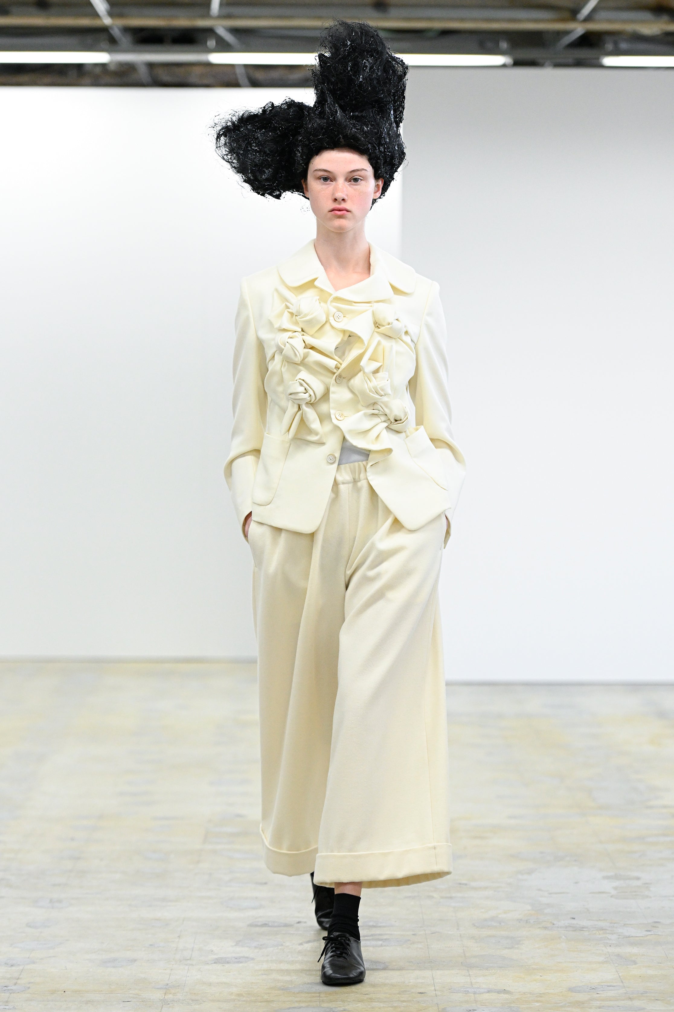 Fashion model wearing a Comme des Garçons Comme des Garçons AW25 outfit
