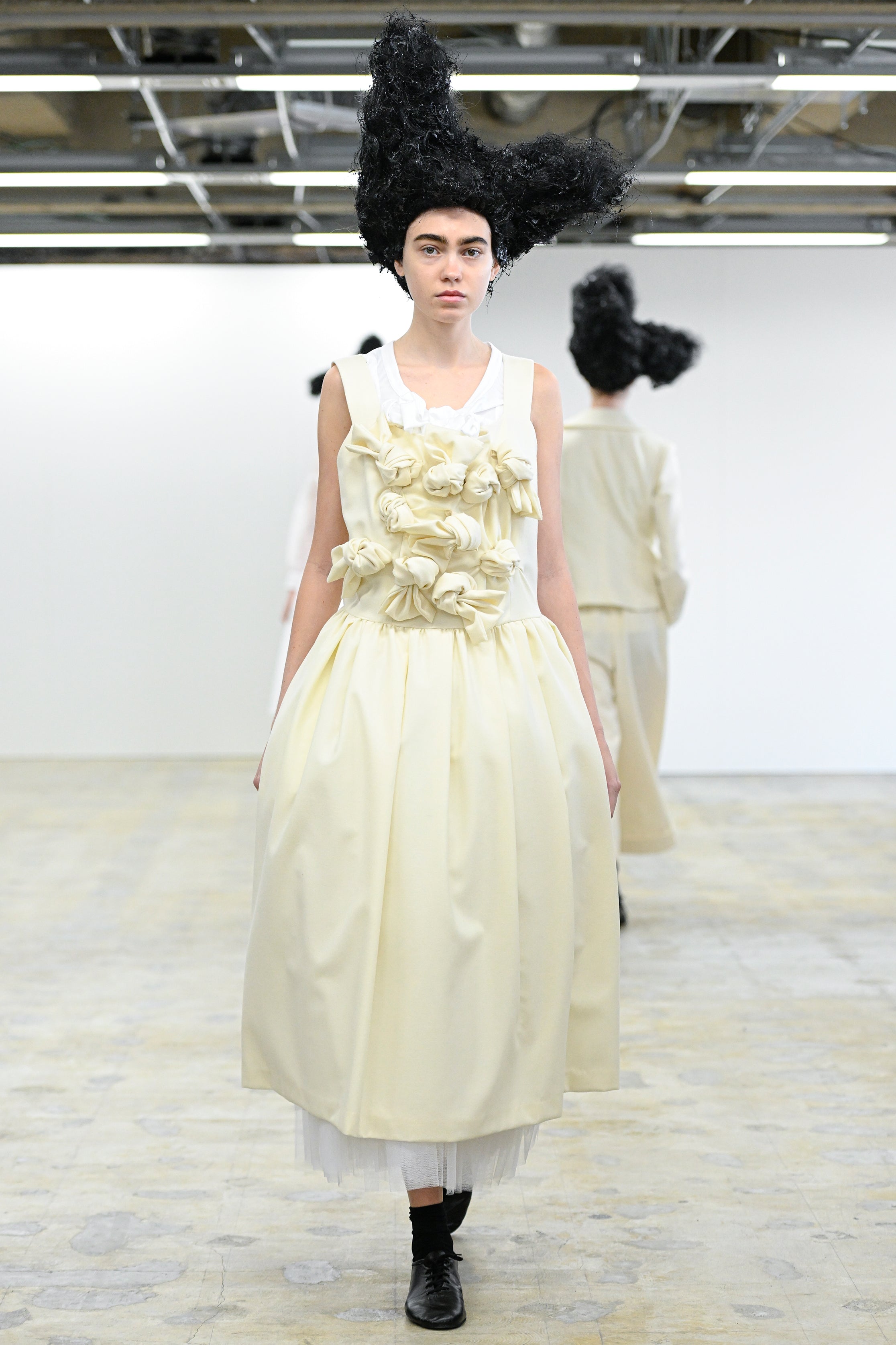Fashion model wearing a Comme des Garçons Comme des Garçons AW25 outfit