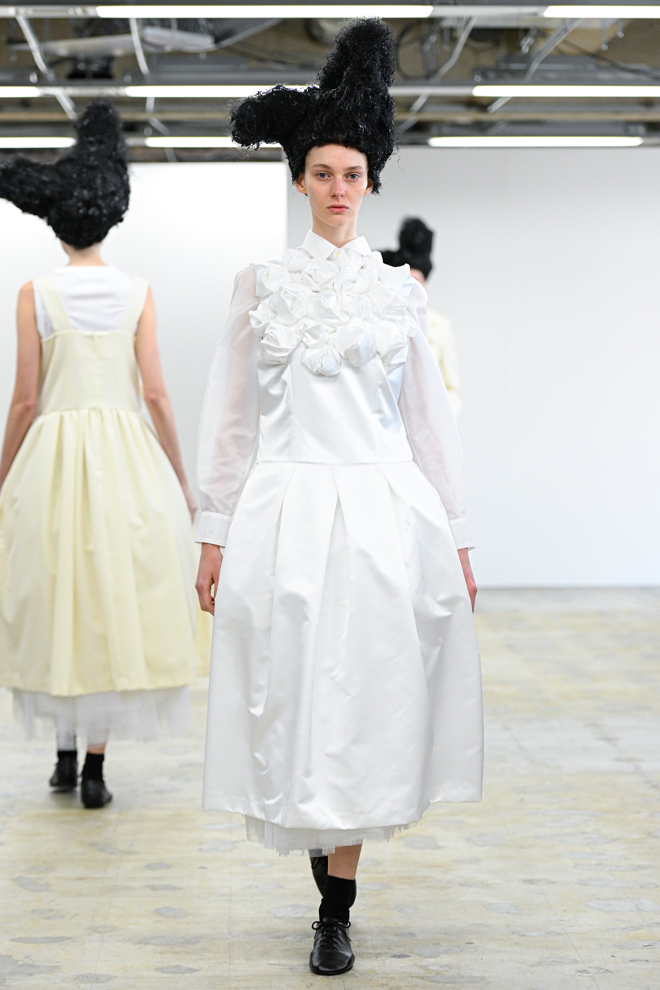 Fashion model wearing a Comme des Garçons Comme des Garçons AW25 outfit