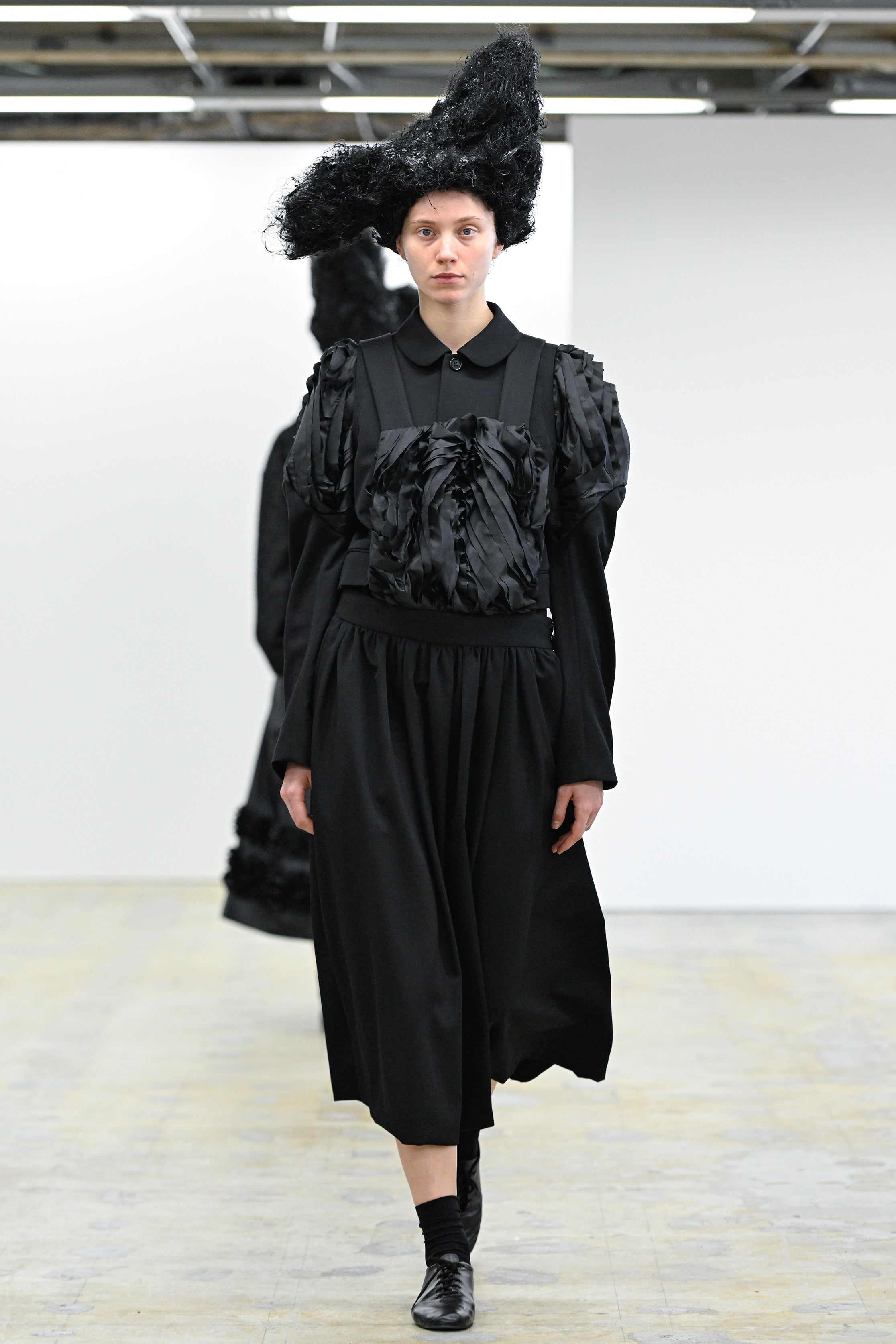 Fashion model wearing a Comme des Garçons Comme des Garçons AW25 outfit