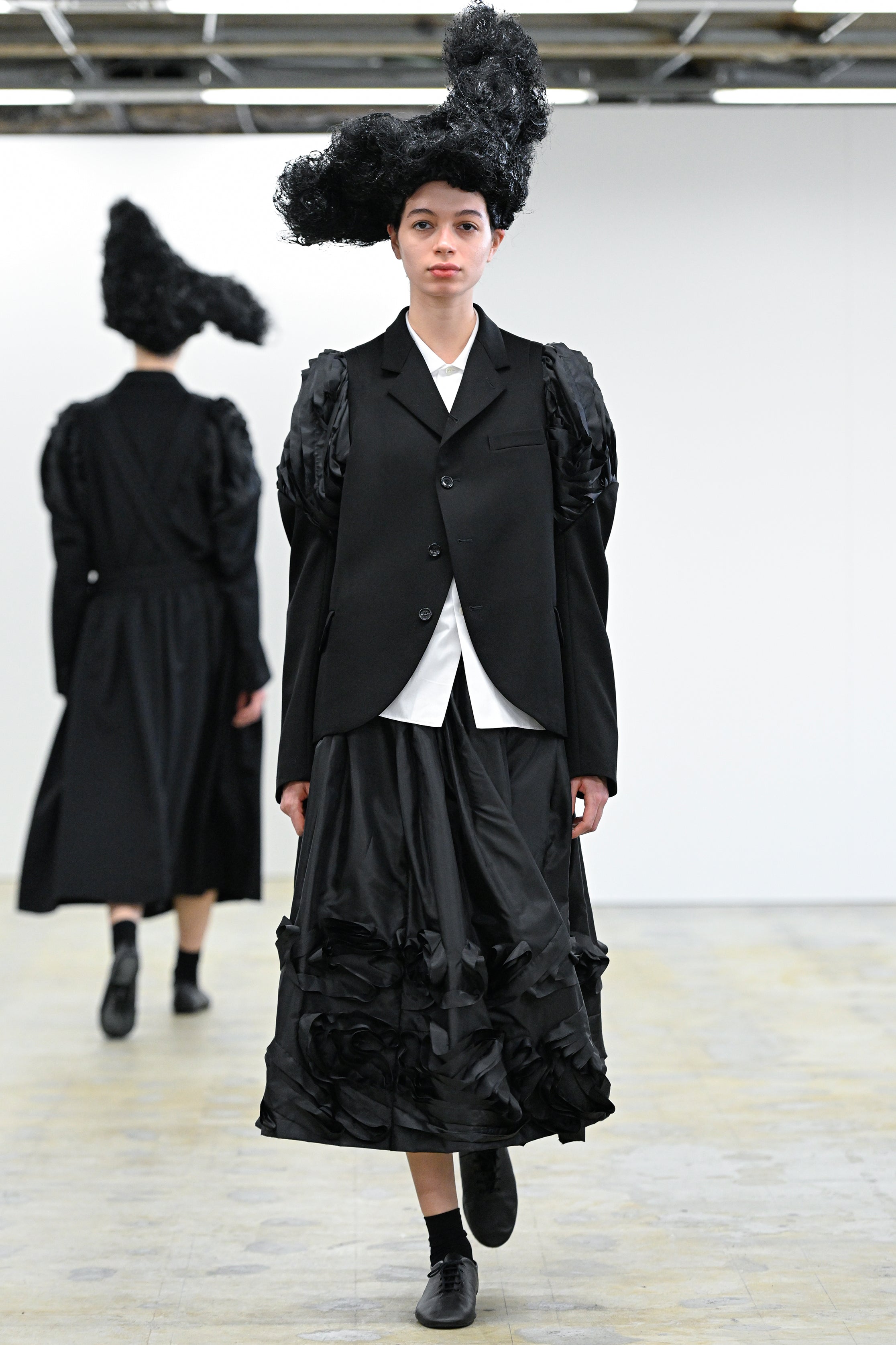 Fashion model wearing a Comme des Garçons Comme des Garçons AW25 outfit