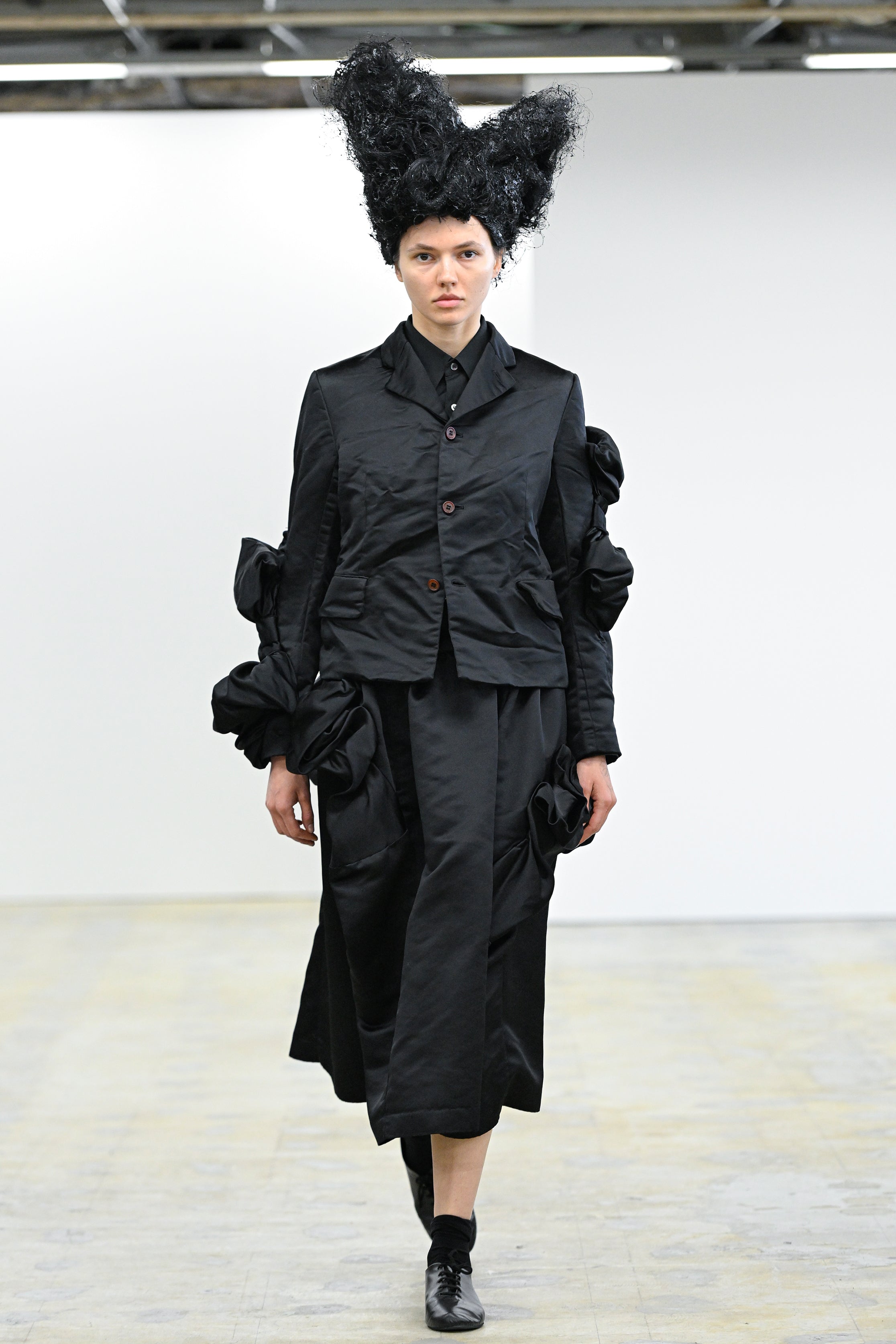 Fashion model wearing a Comme des Garçons Comme des Garçons AW25 outfit