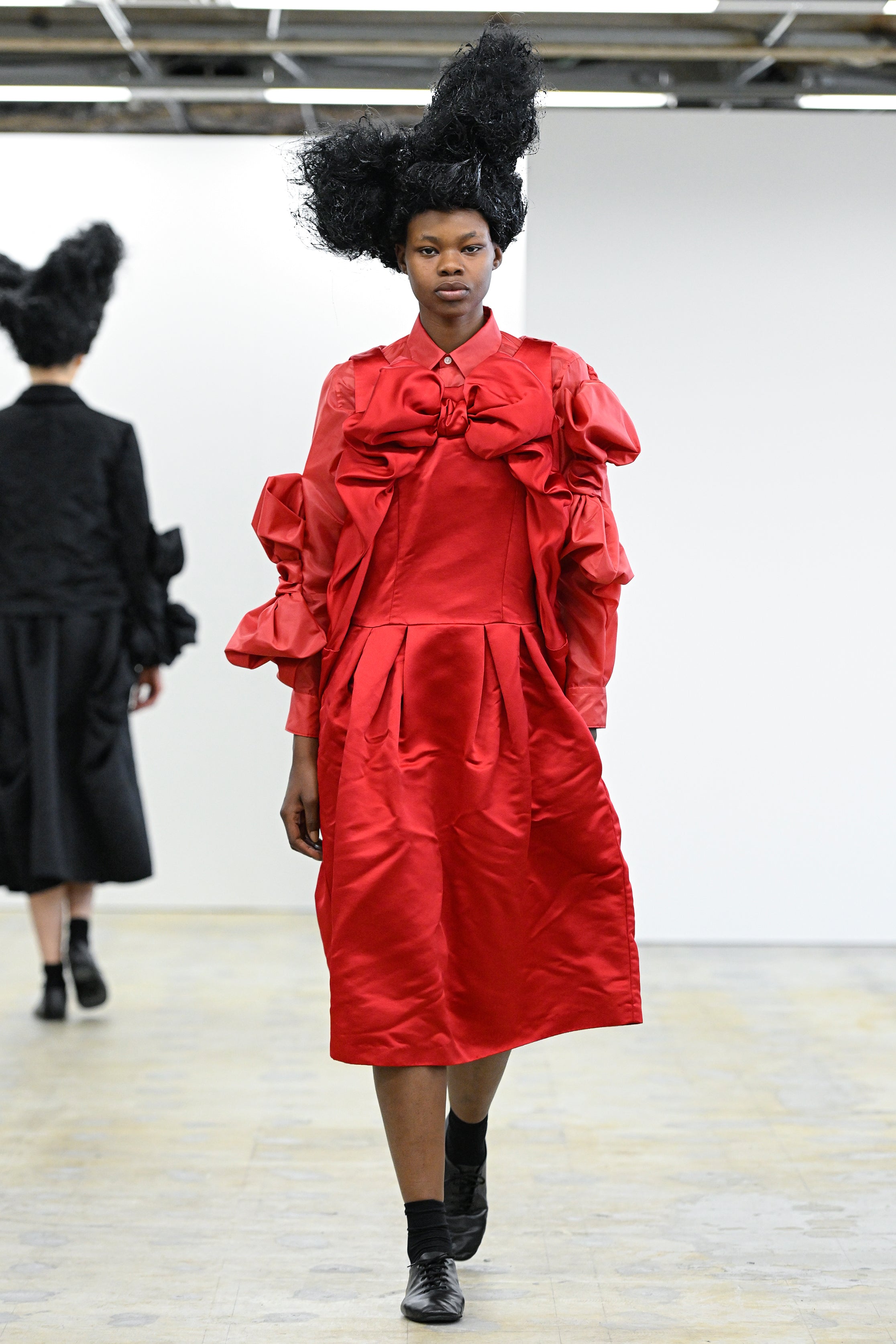 Fashion model wearing a Comme des Garçons Comme des Garçons AW25 outfit