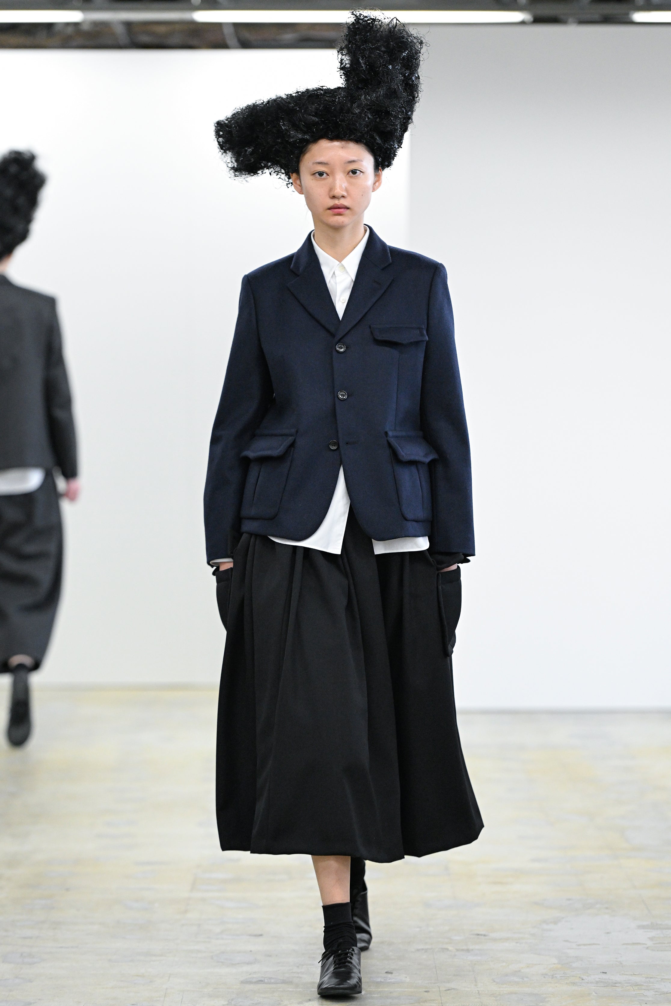 Fashion model wearing a Comme des Garçons Comme des Garçons AW25 outfit