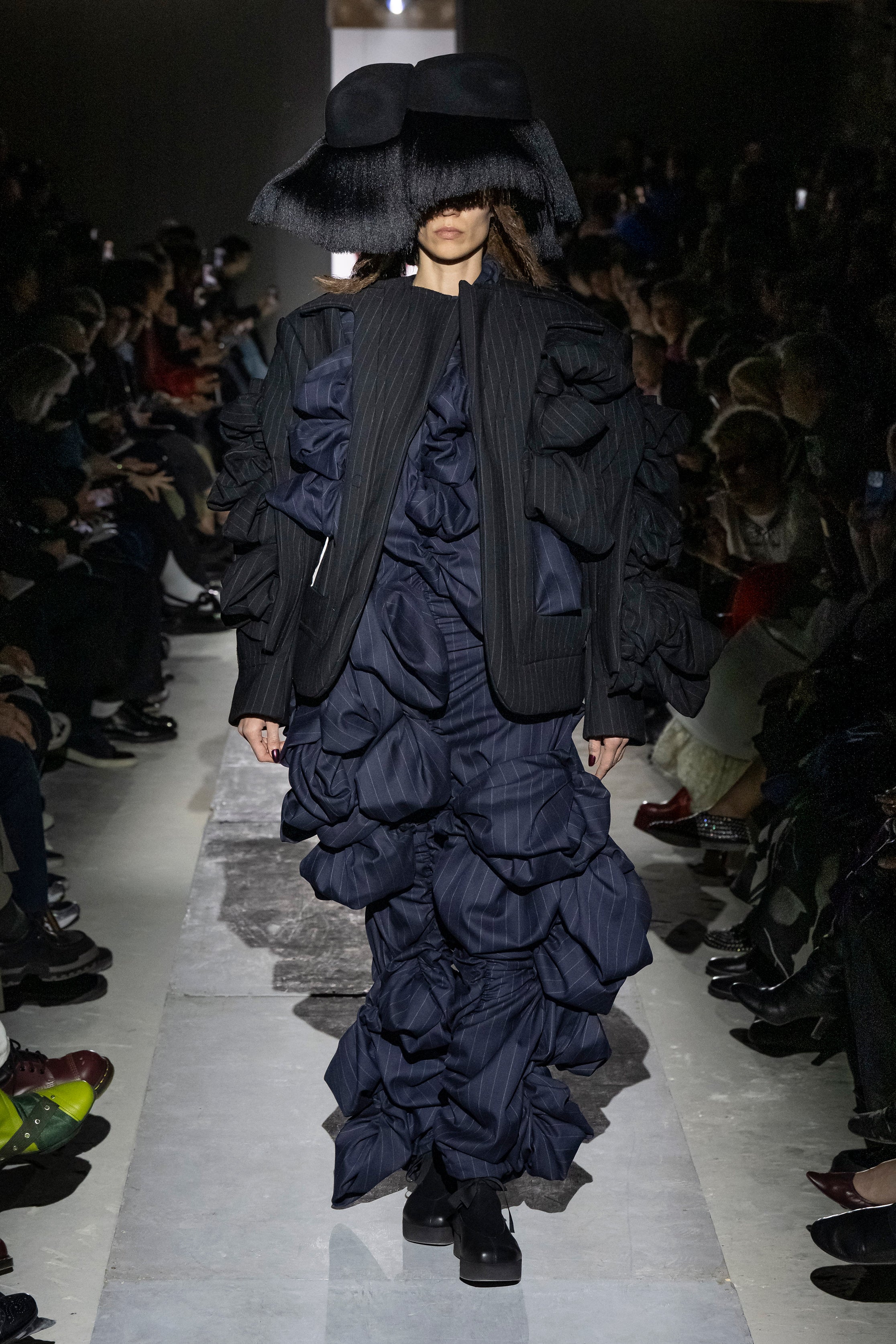 Fashion model wearing a Comme des Garçons AW25 outfit