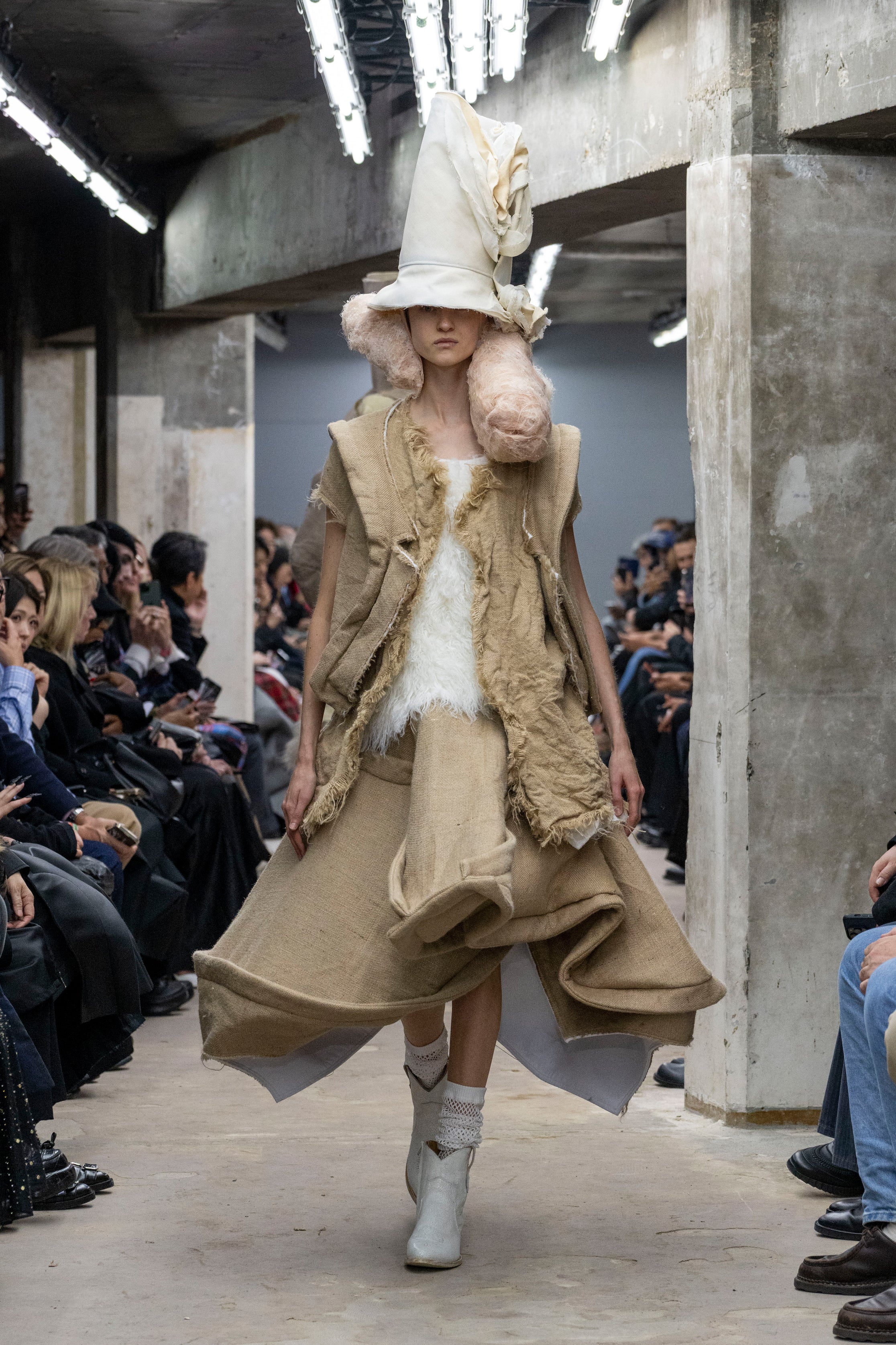 Fashion model wearing a Comme des Garçons SS26 outfit