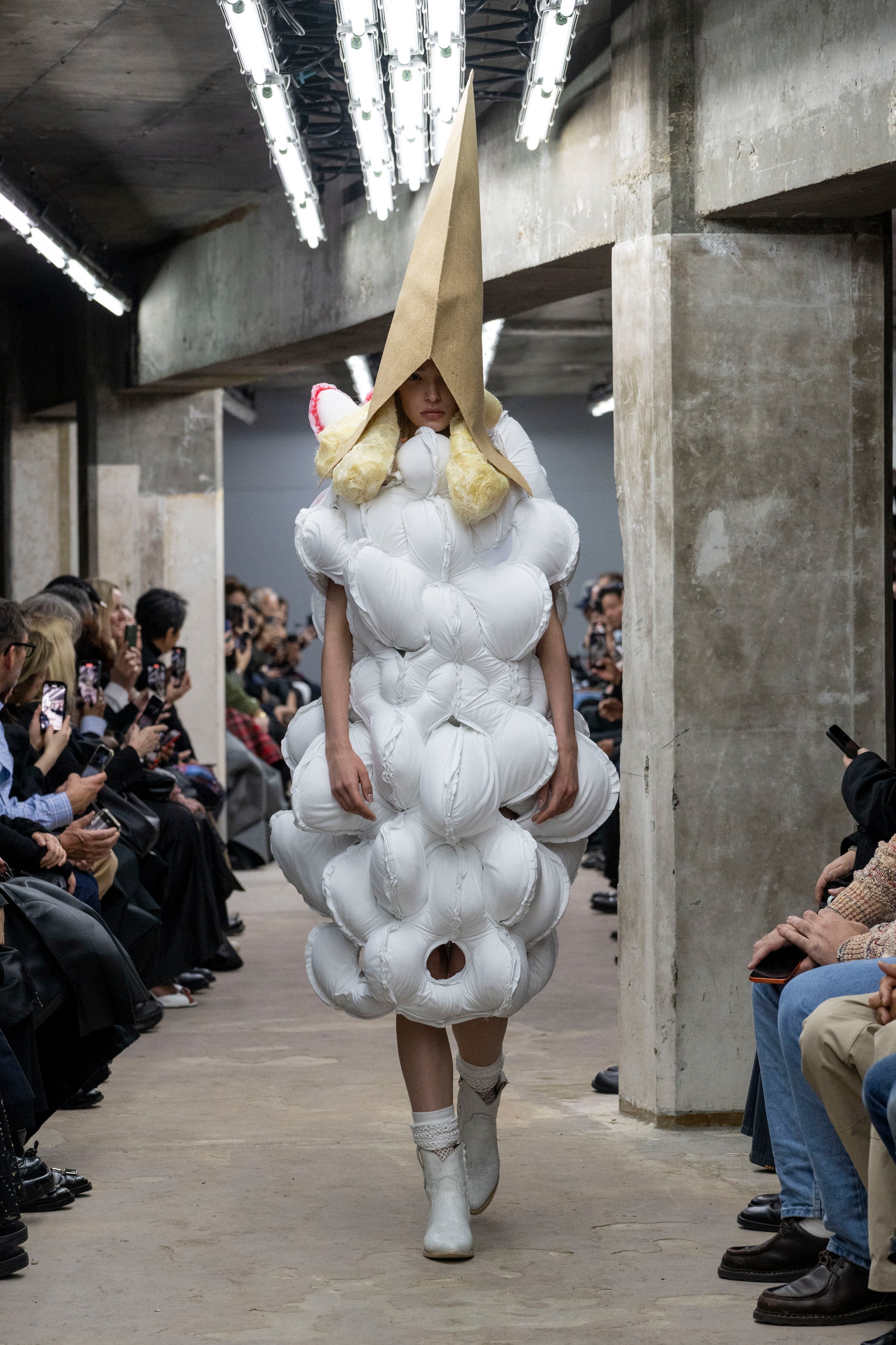 Fashion model wearing a Comme des Garçons SS26 outfit