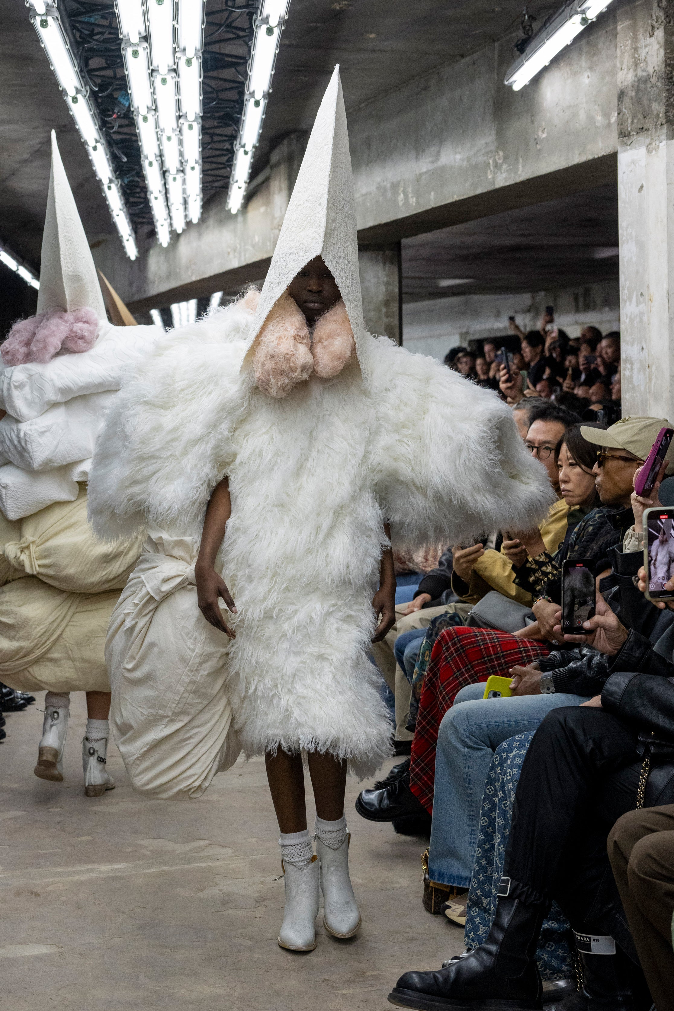 Fashion model wearing a Comme des Garçons SS26 outfit