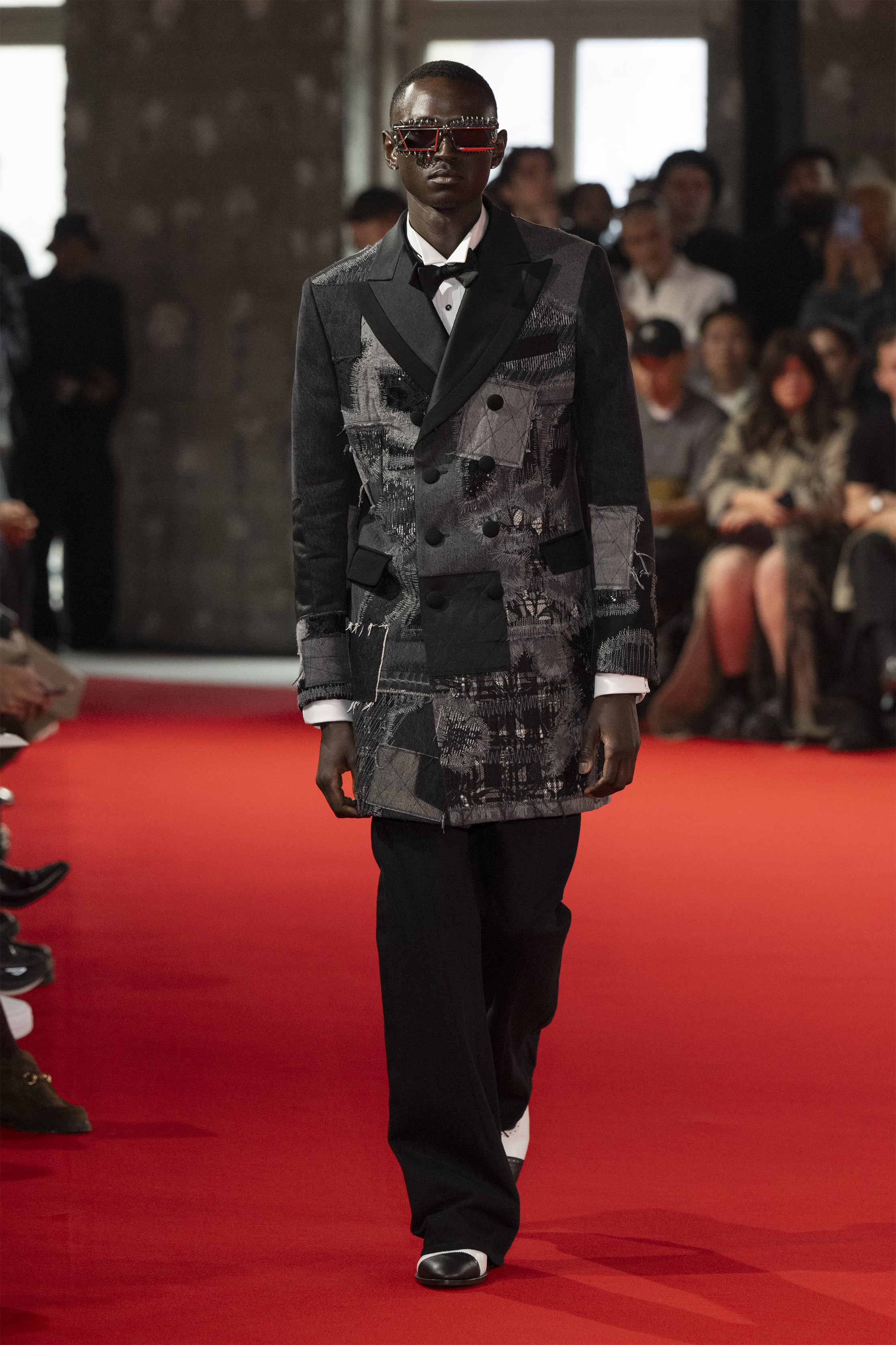 Fashion model wearing a JUNYA WATANABE MAN SS25 outfit